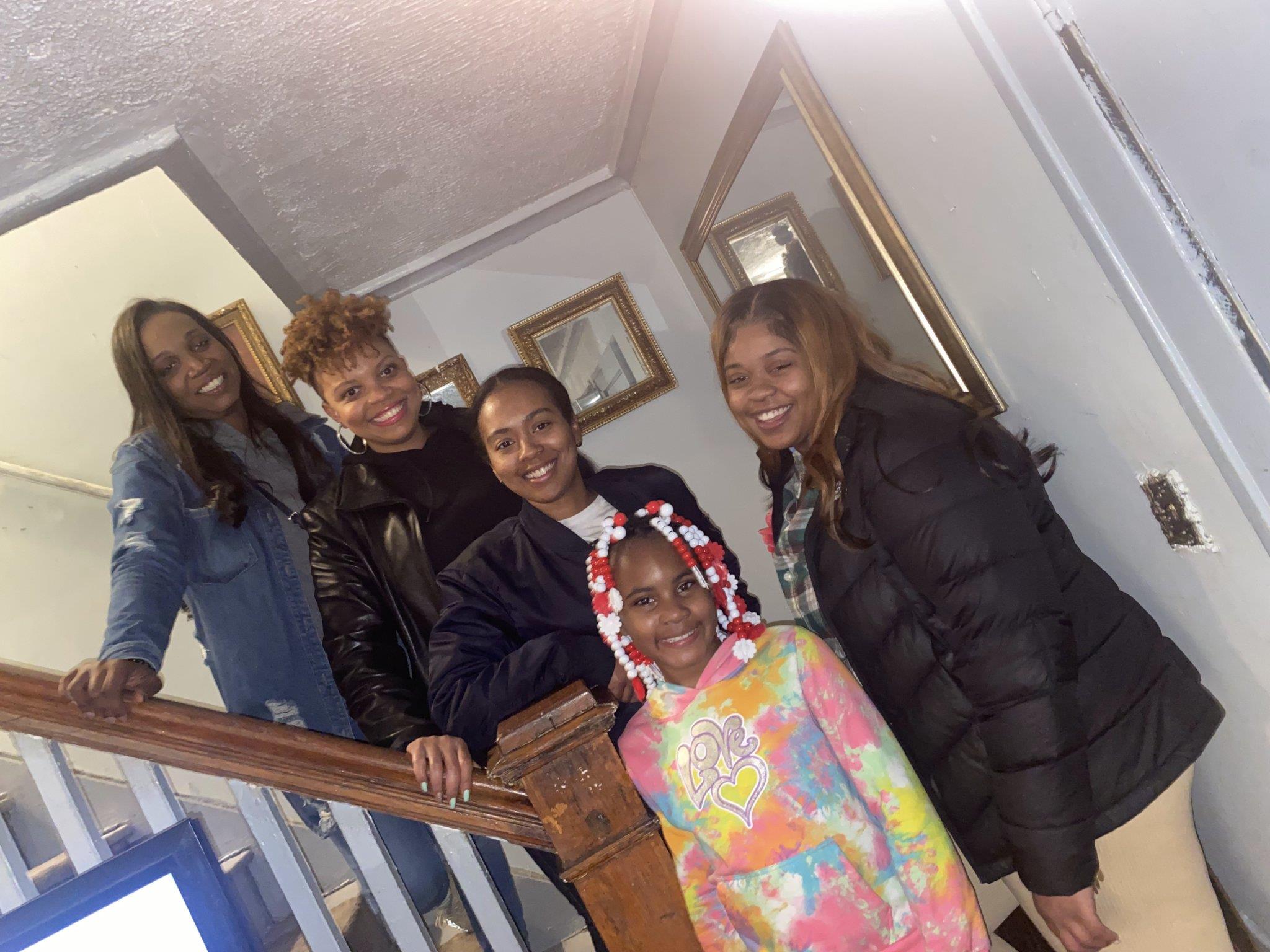 A group of women standing on a staircase