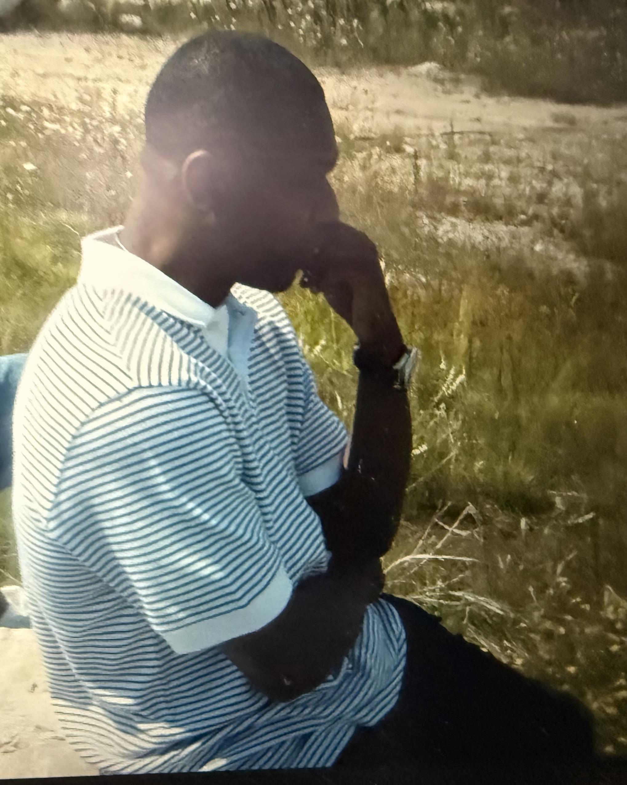 A man sitting in a field