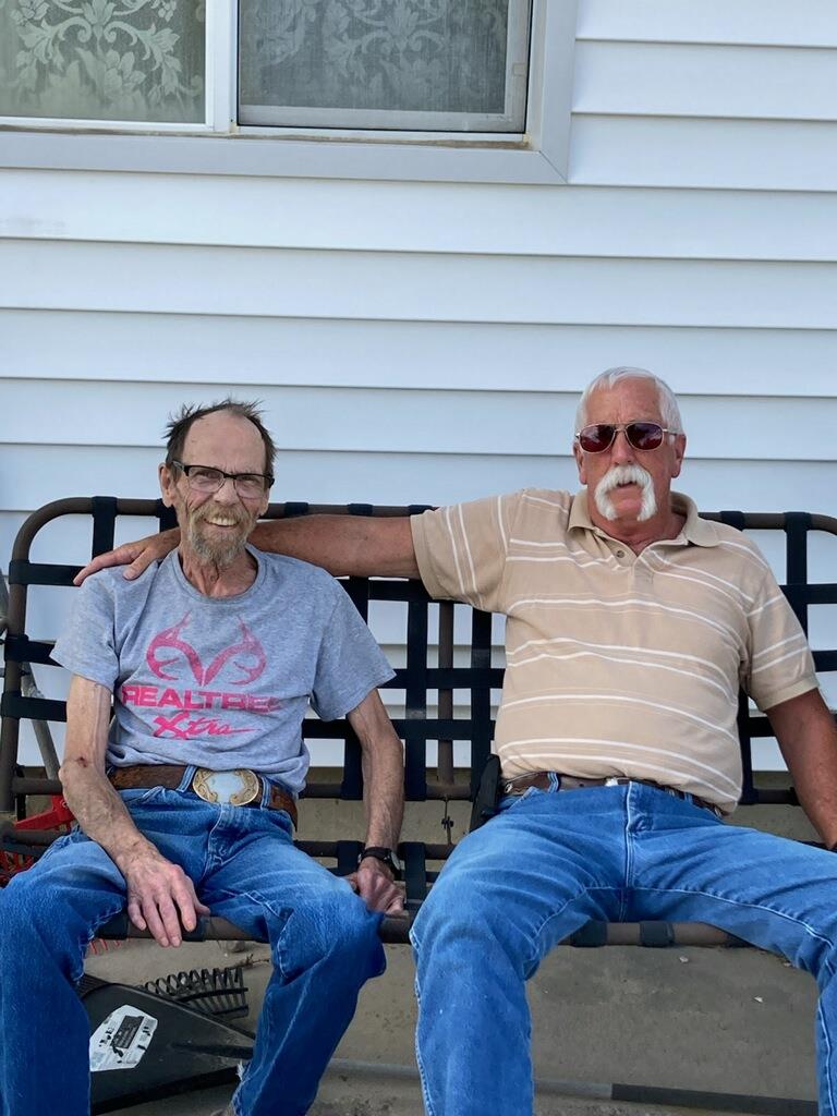Two men sitting on a bench