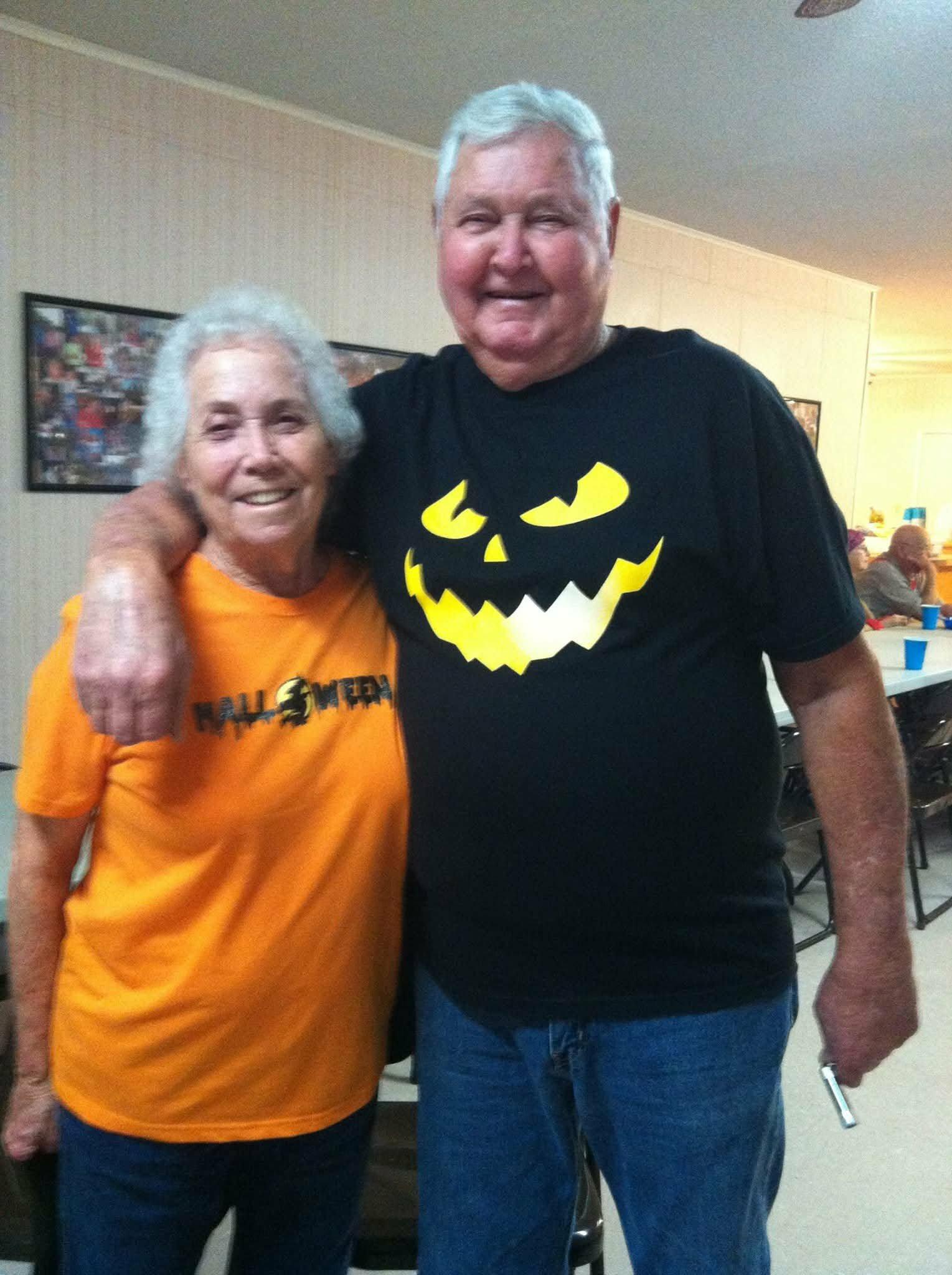 A man and woman posing for a picture