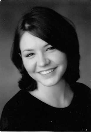 A close-up of a woman smiling