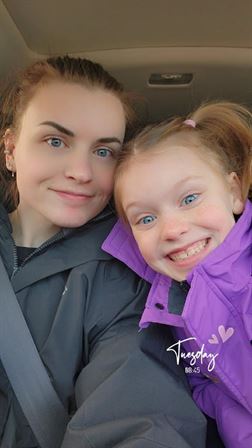 A woman and a girl taking a selfie