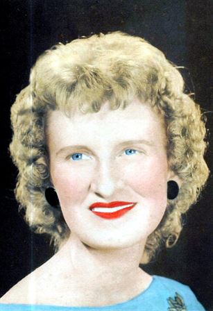 A woman with curly blonde hair and red lipstick