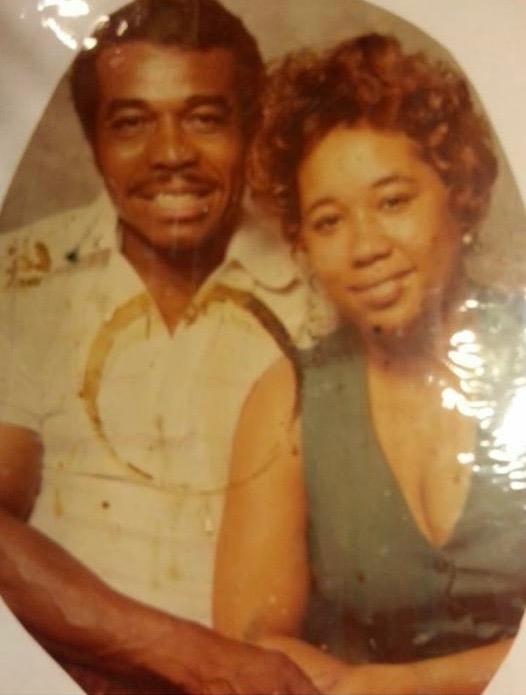 A man and woman posing for a picture