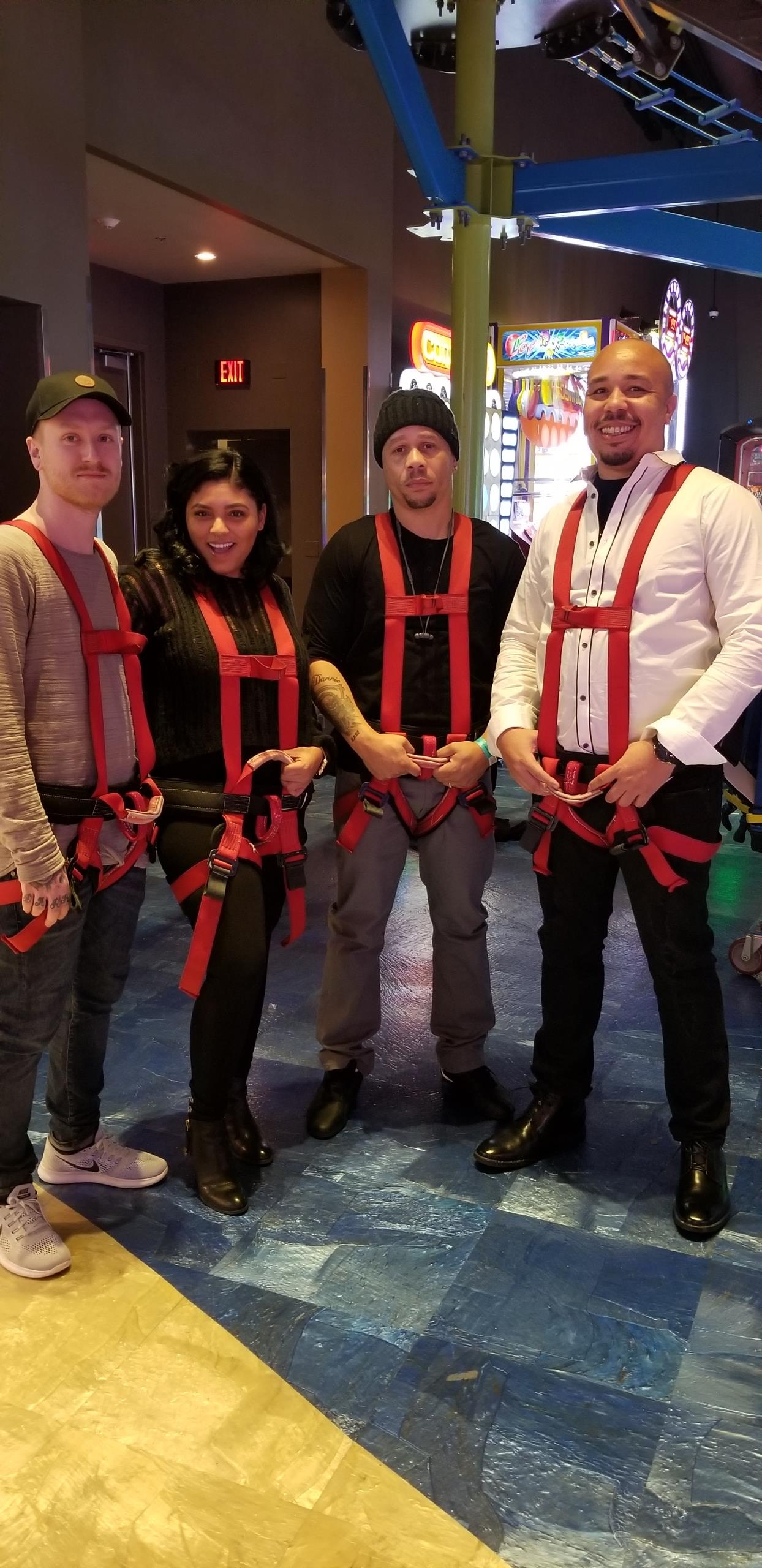 A group of people wearing harnesses