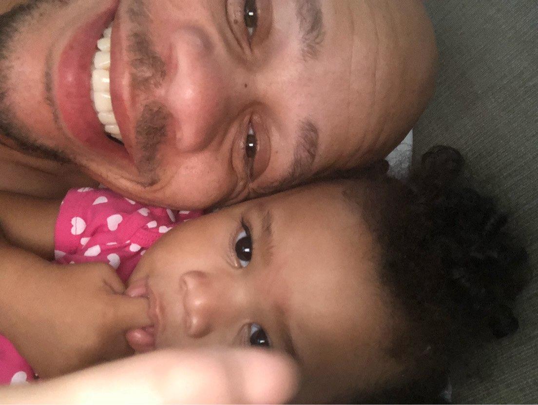 A man and a baby taking a selfie