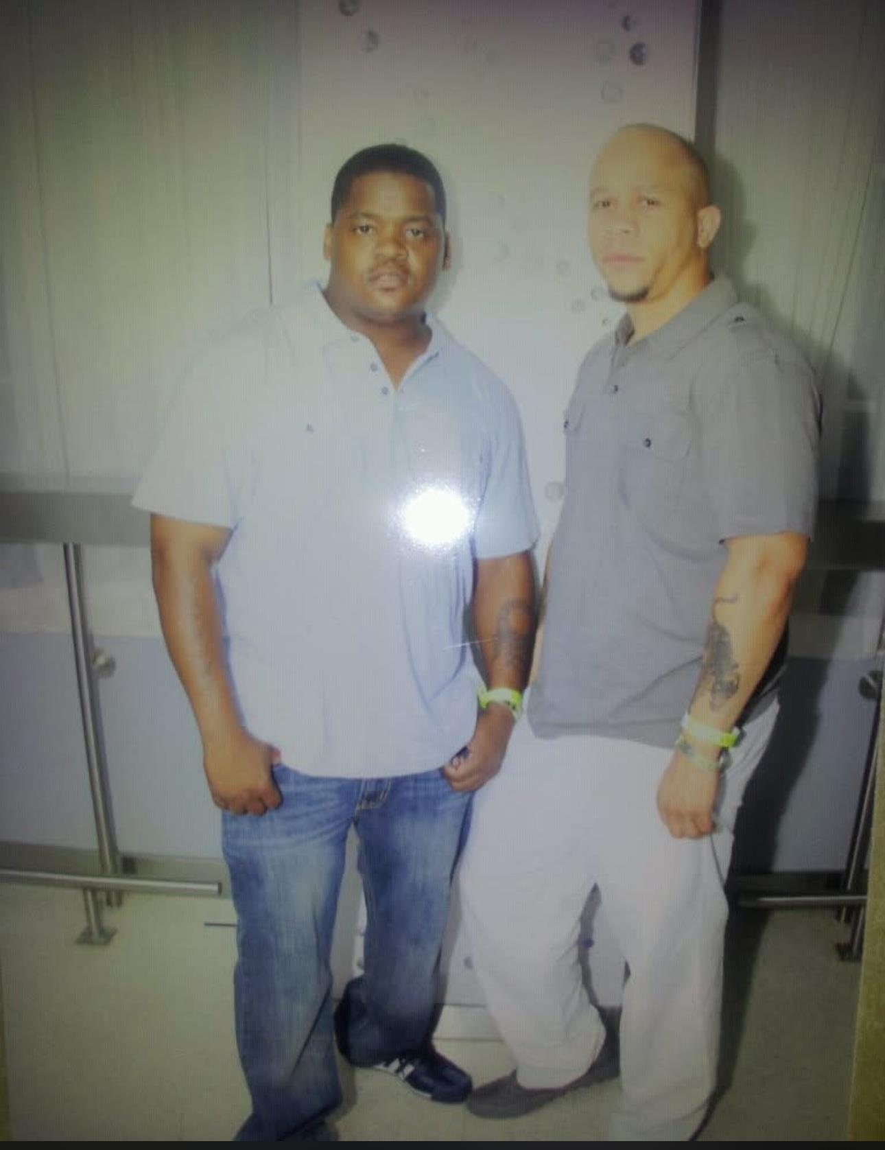 Two men standing next to each other