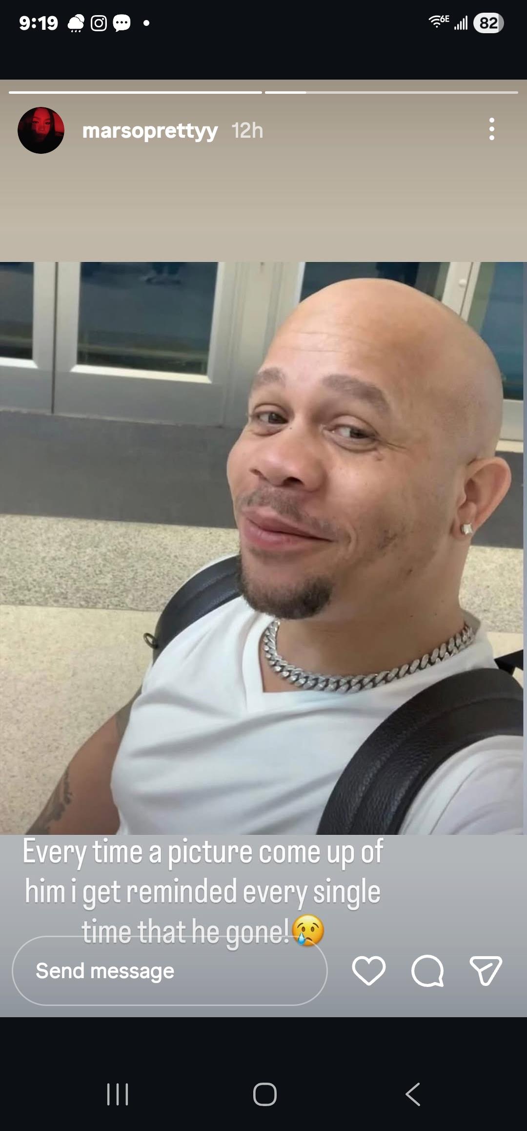 A man wearing a backpack and a white shirt