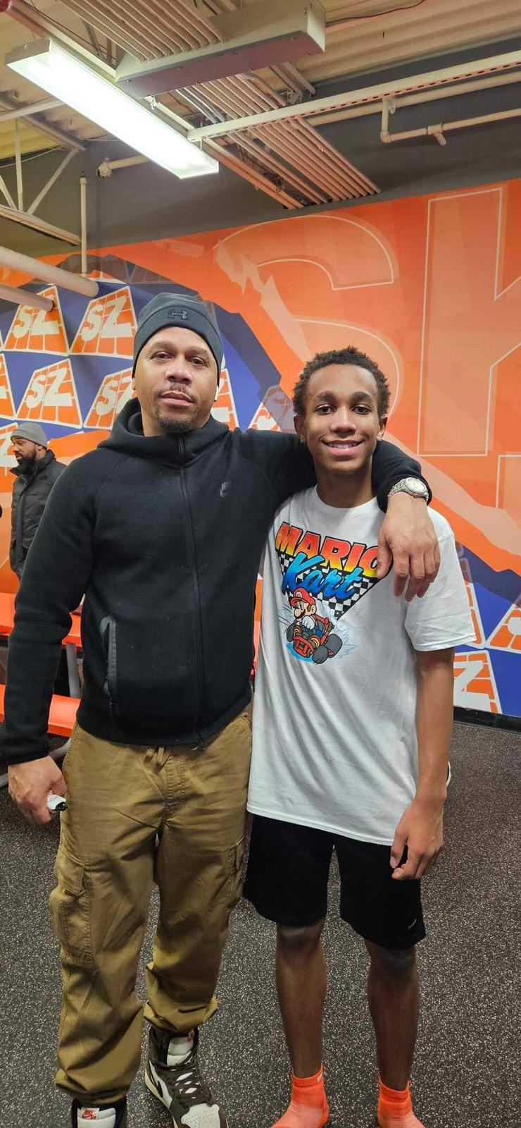 A man and boy posing for a picture