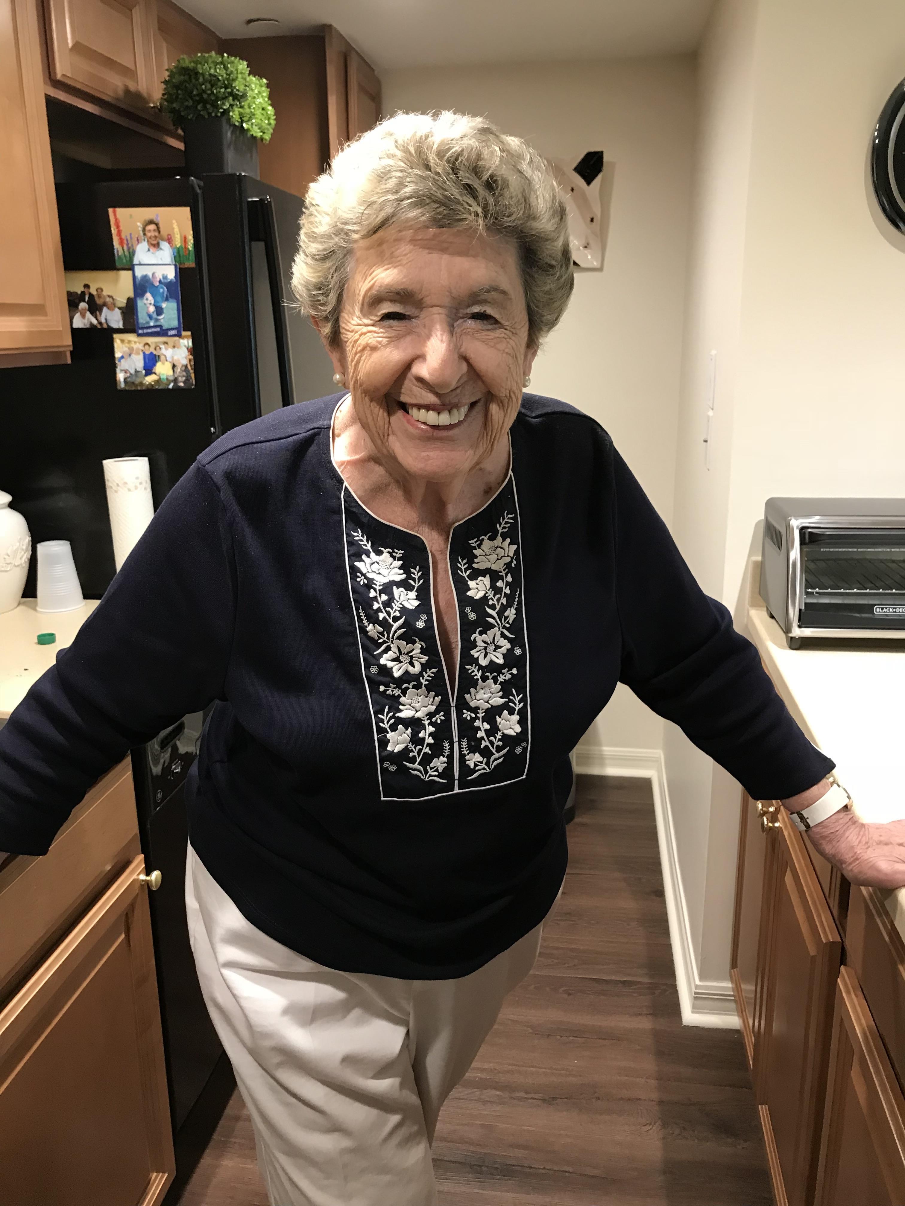 A woman standing in a kitchen