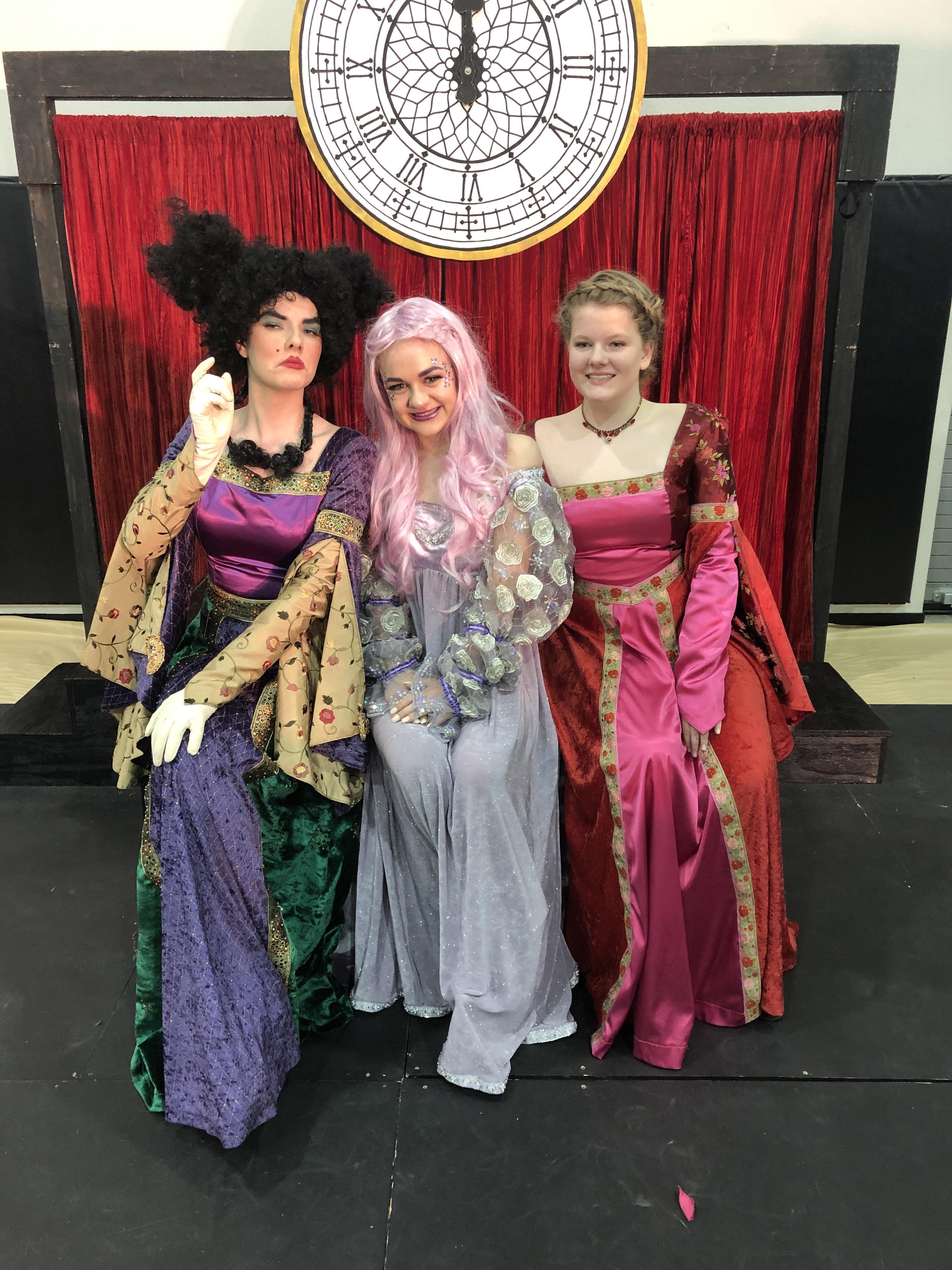 A group of women in clothing posing for a photo