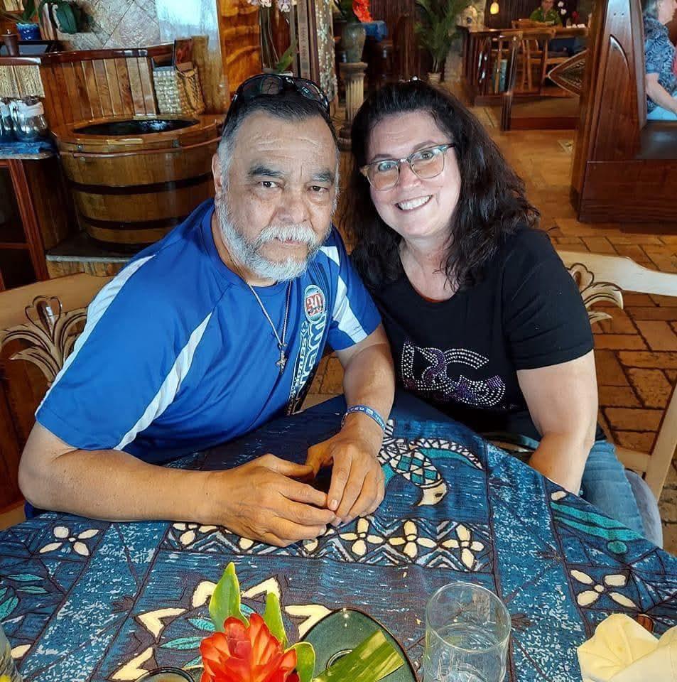A man and woman sitting at a table
