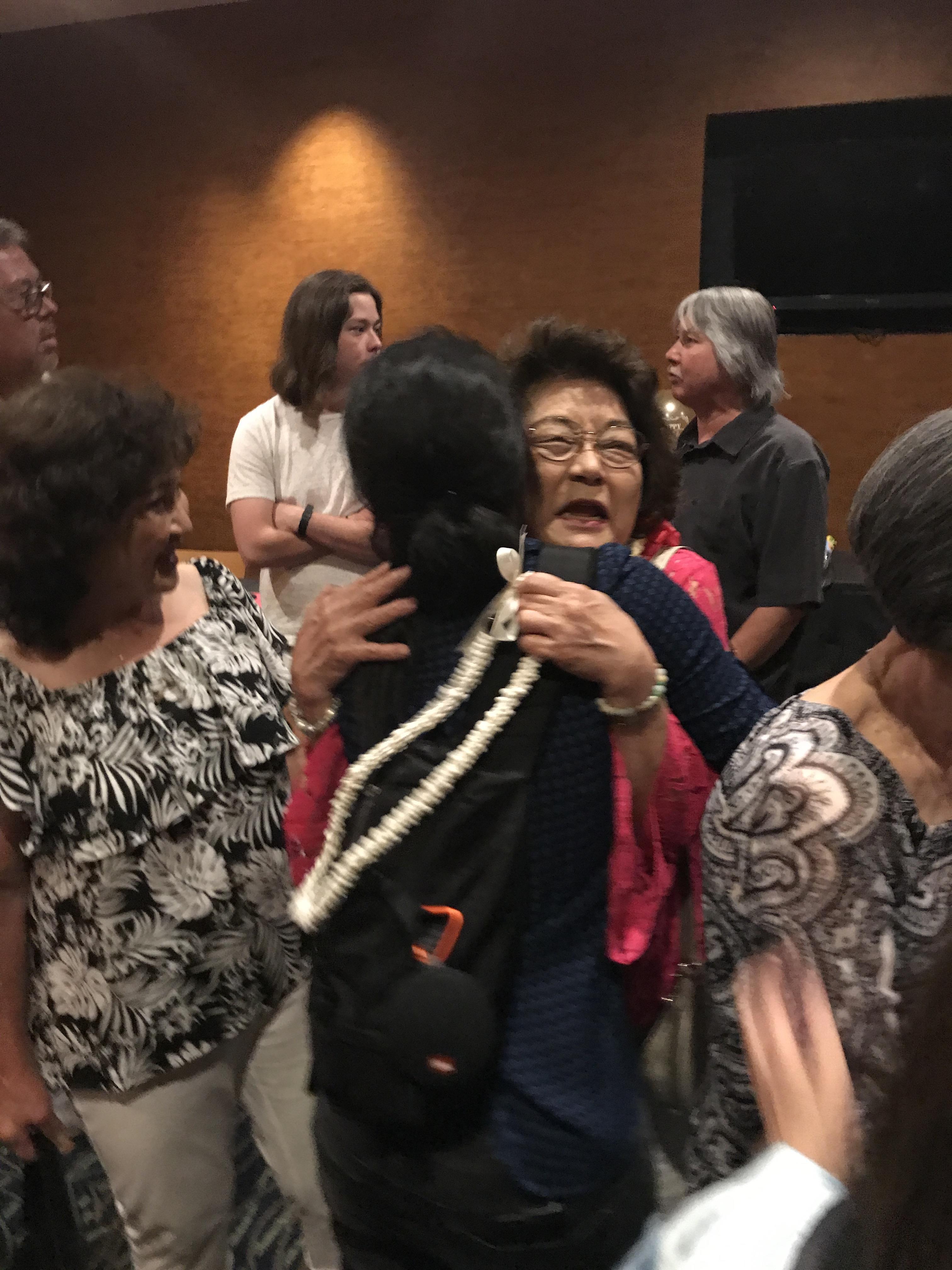 A group of people around each other