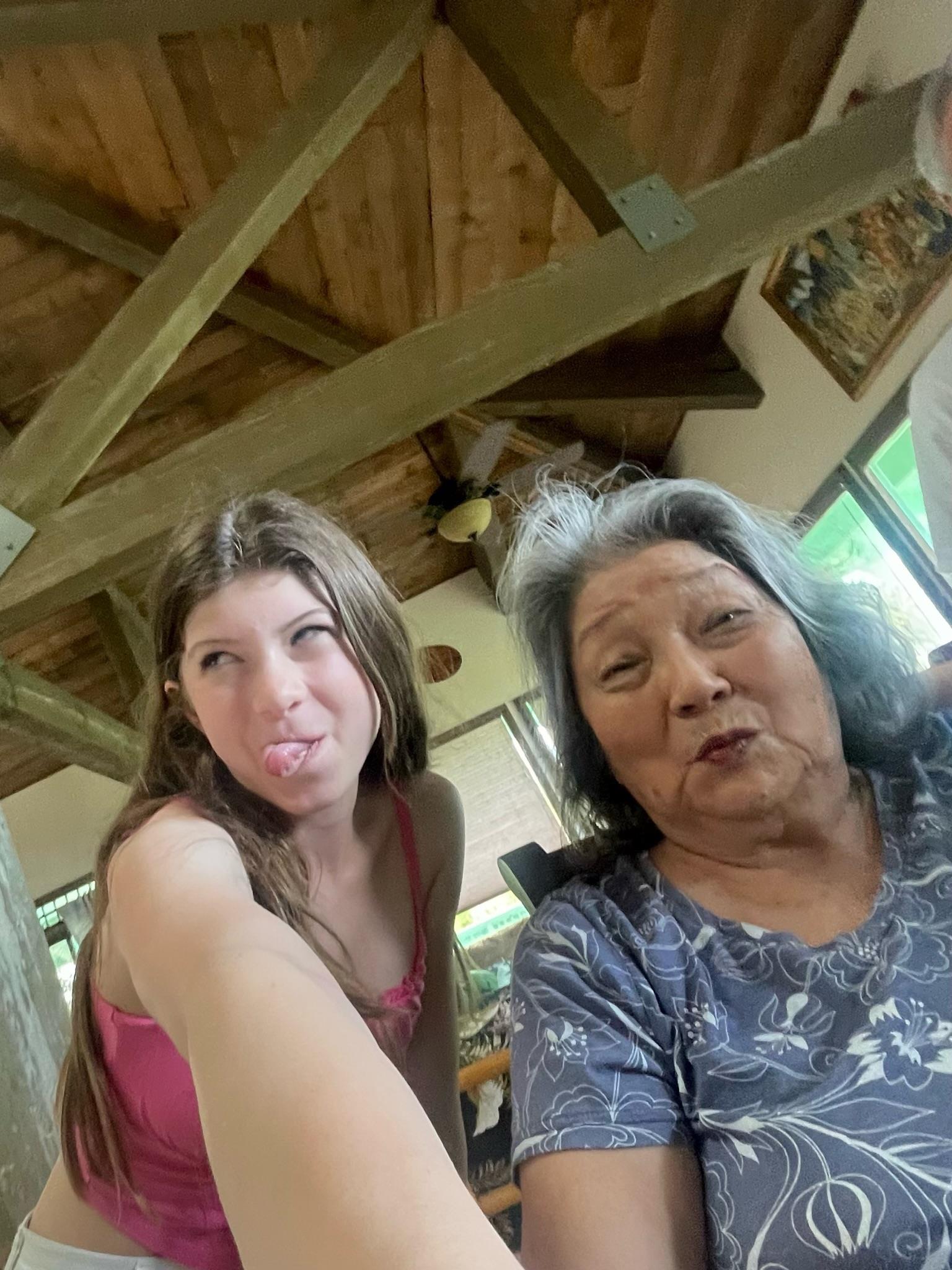 A woman and a woman taking a selfie