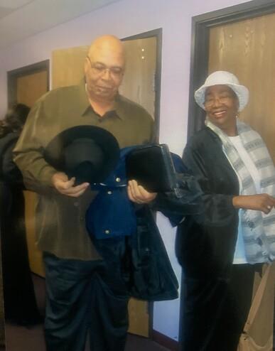 A man and woman standing in a doorway