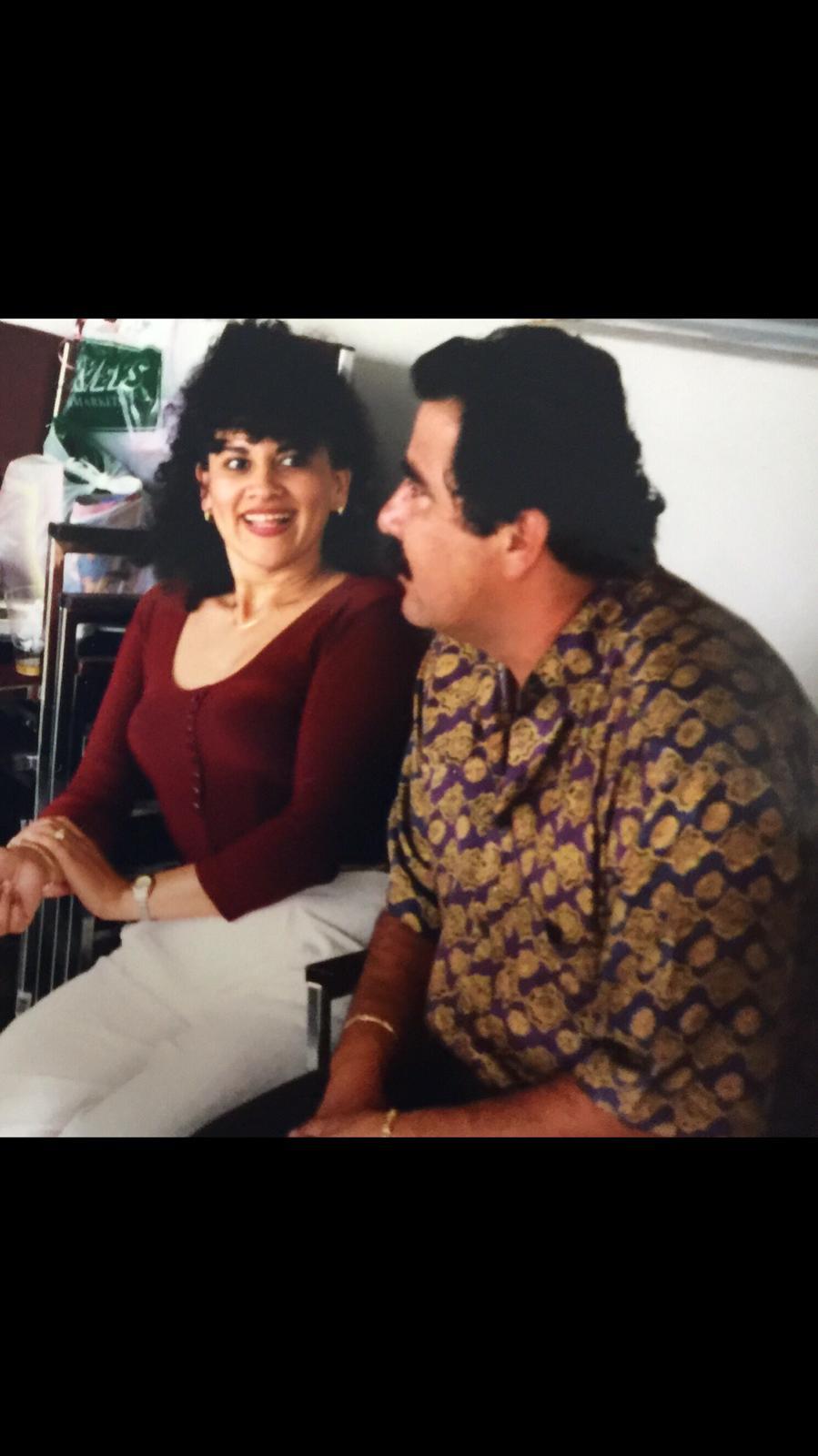 People are sharing a moment while talking in a casual setting with a relaxed atmosphere.