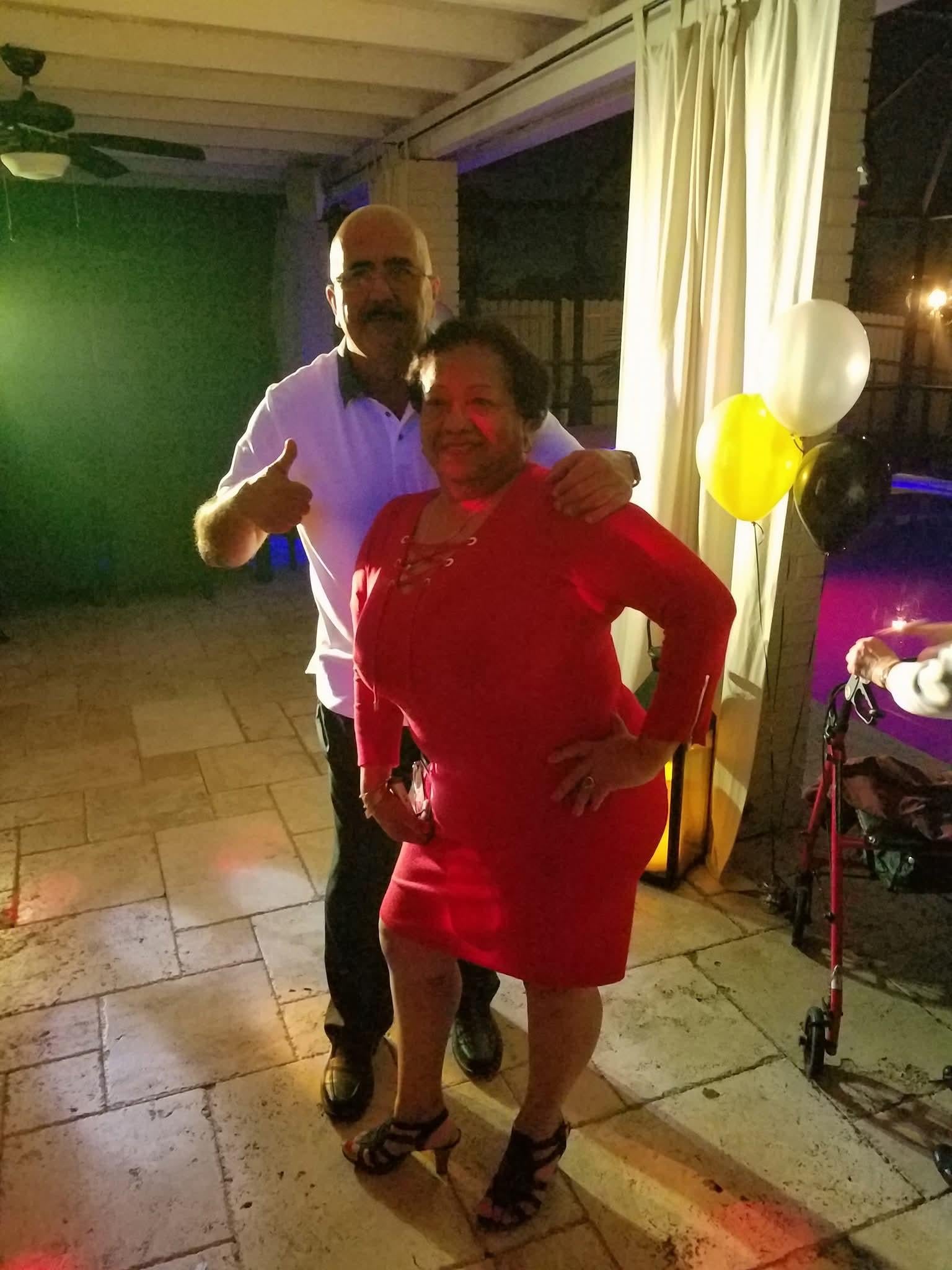 A man and woman posing for a picture