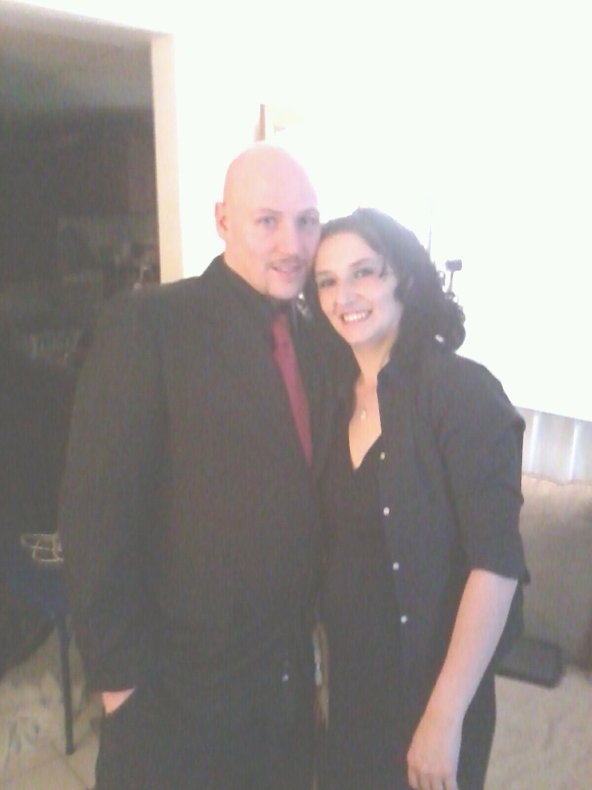 A man and woman posing for a picture