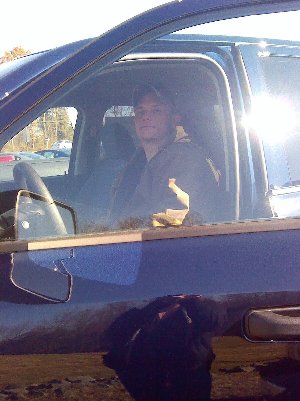 A man sitting in a car