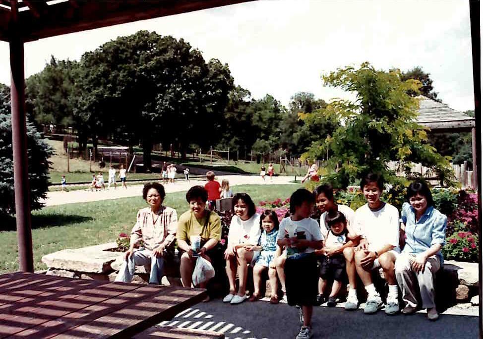 A group of people sitting on a bench