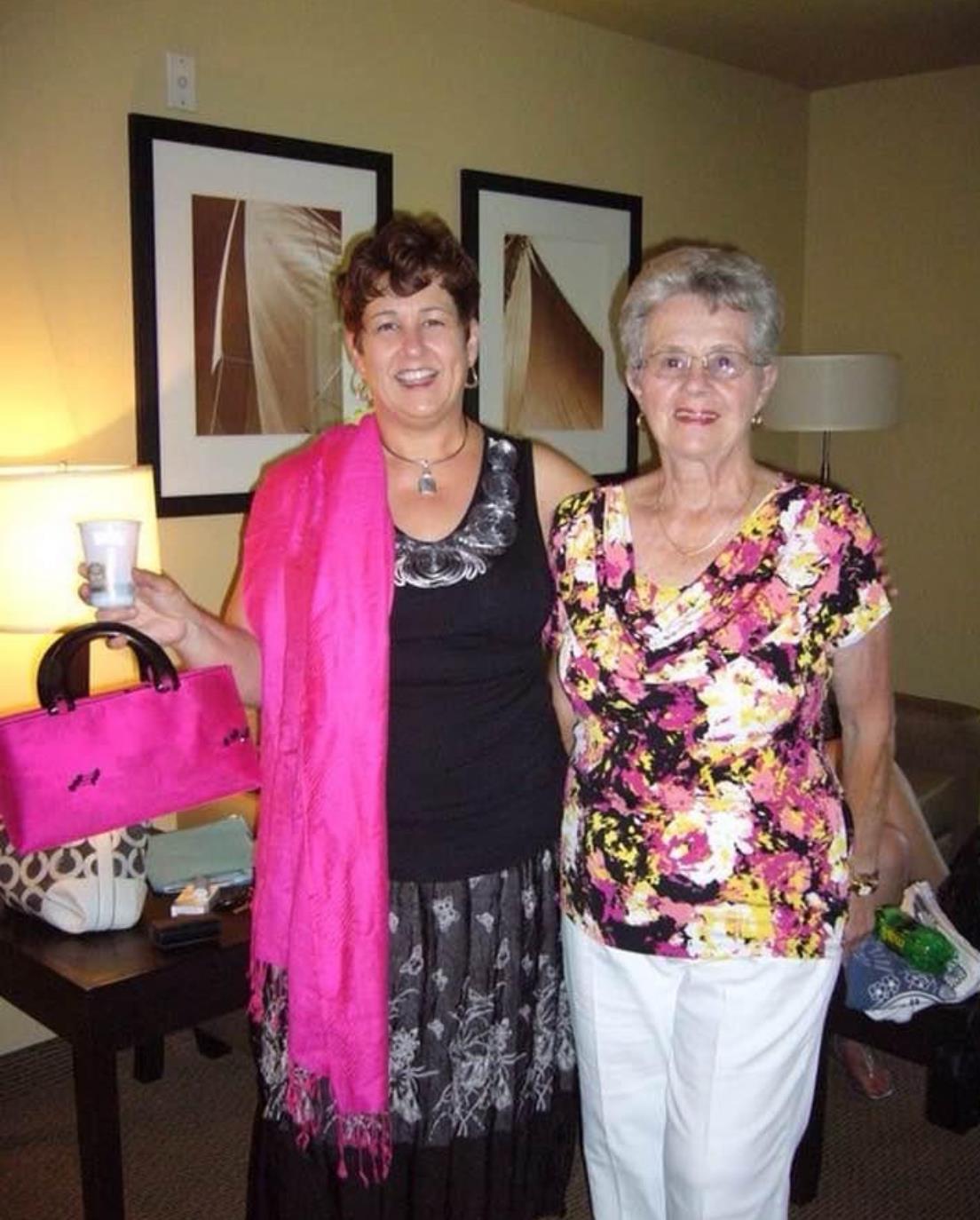 A couple of women posing for a picture