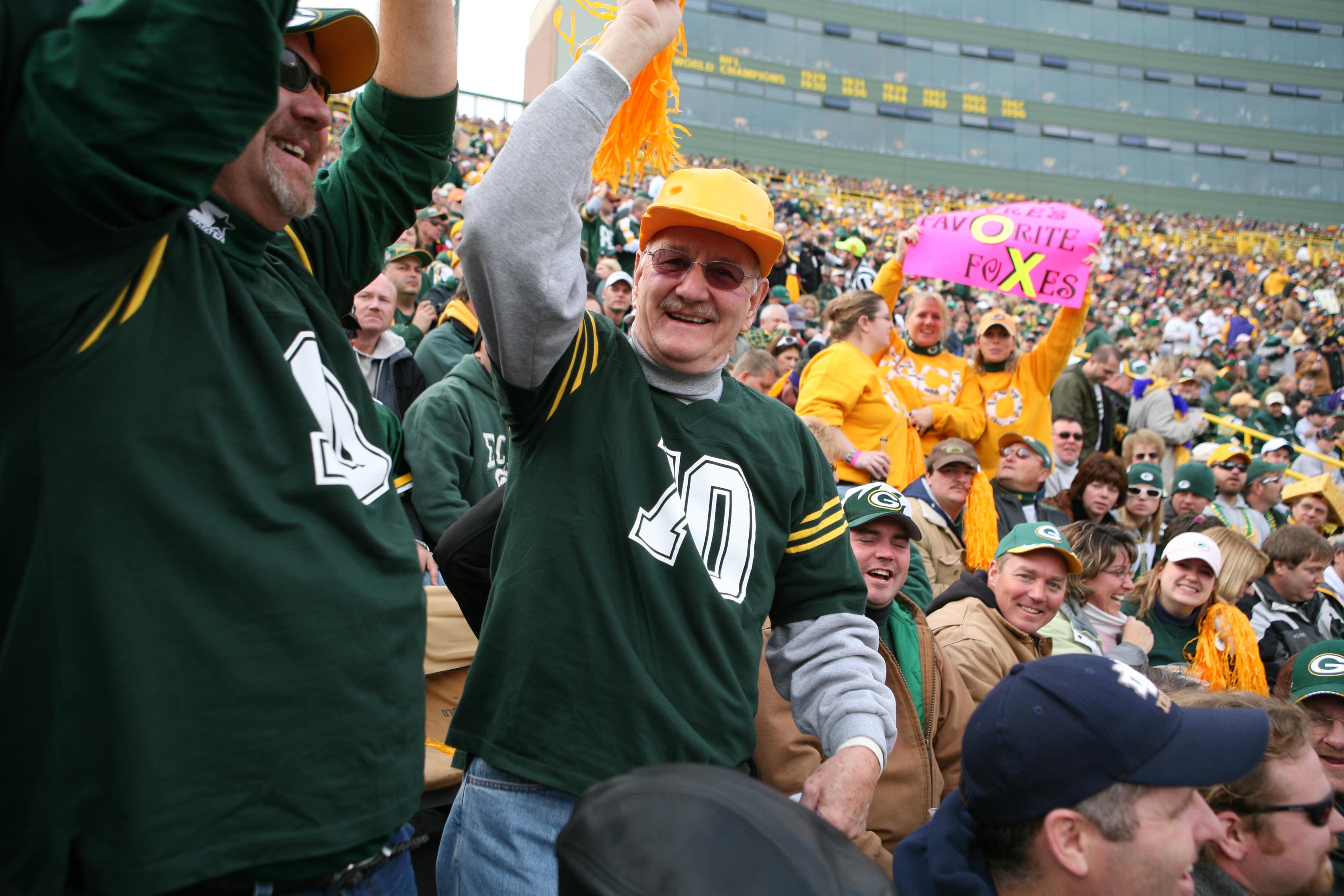 A group of people in green shirts
