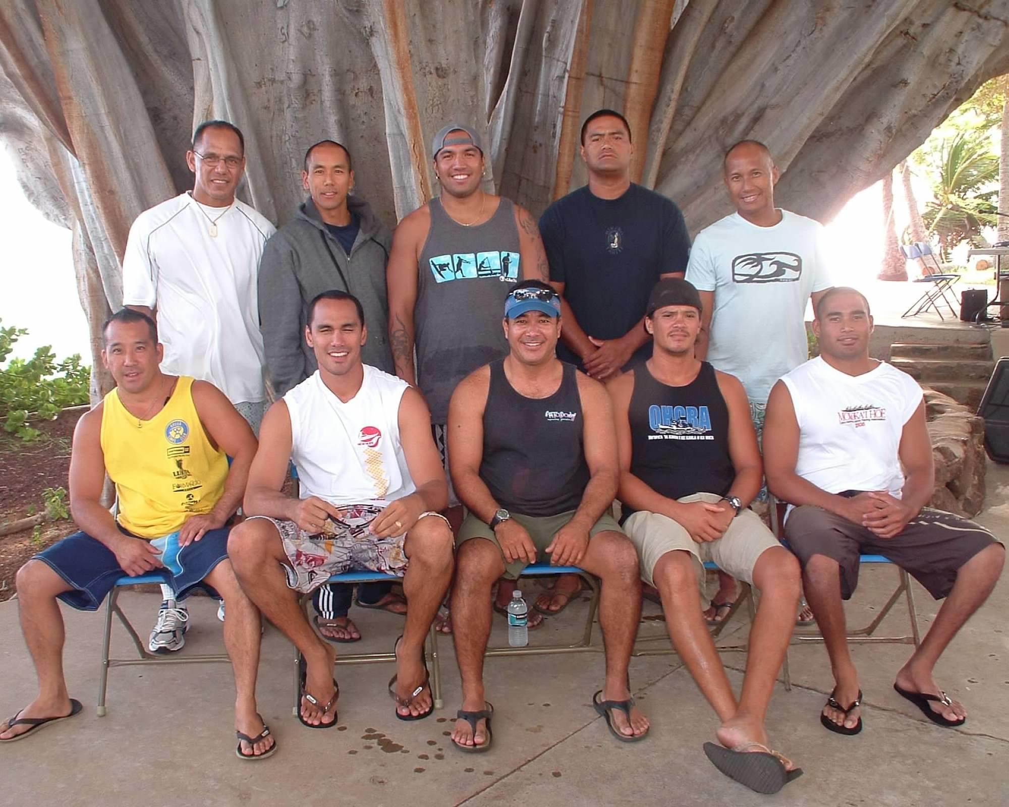A group of men posing for a photo