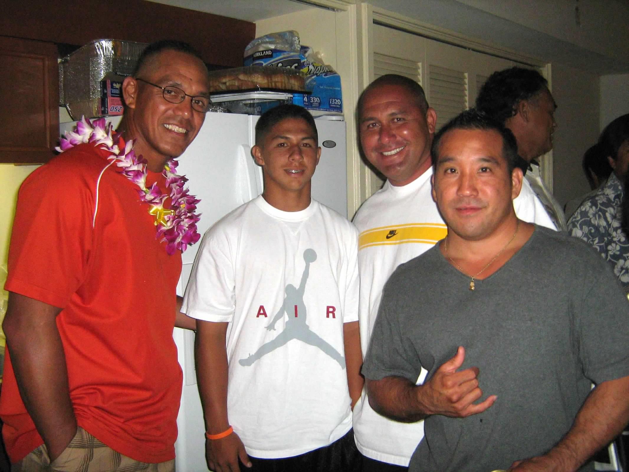 A group of men posing for a photo