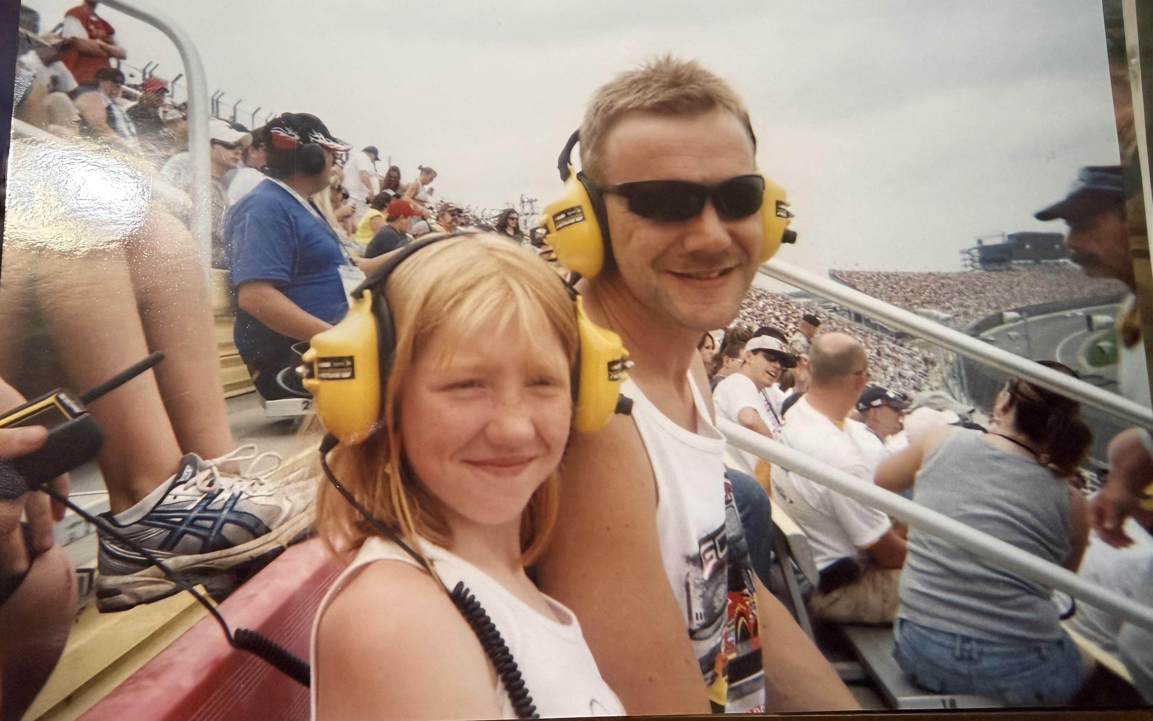 A man and a girl wearing headphones