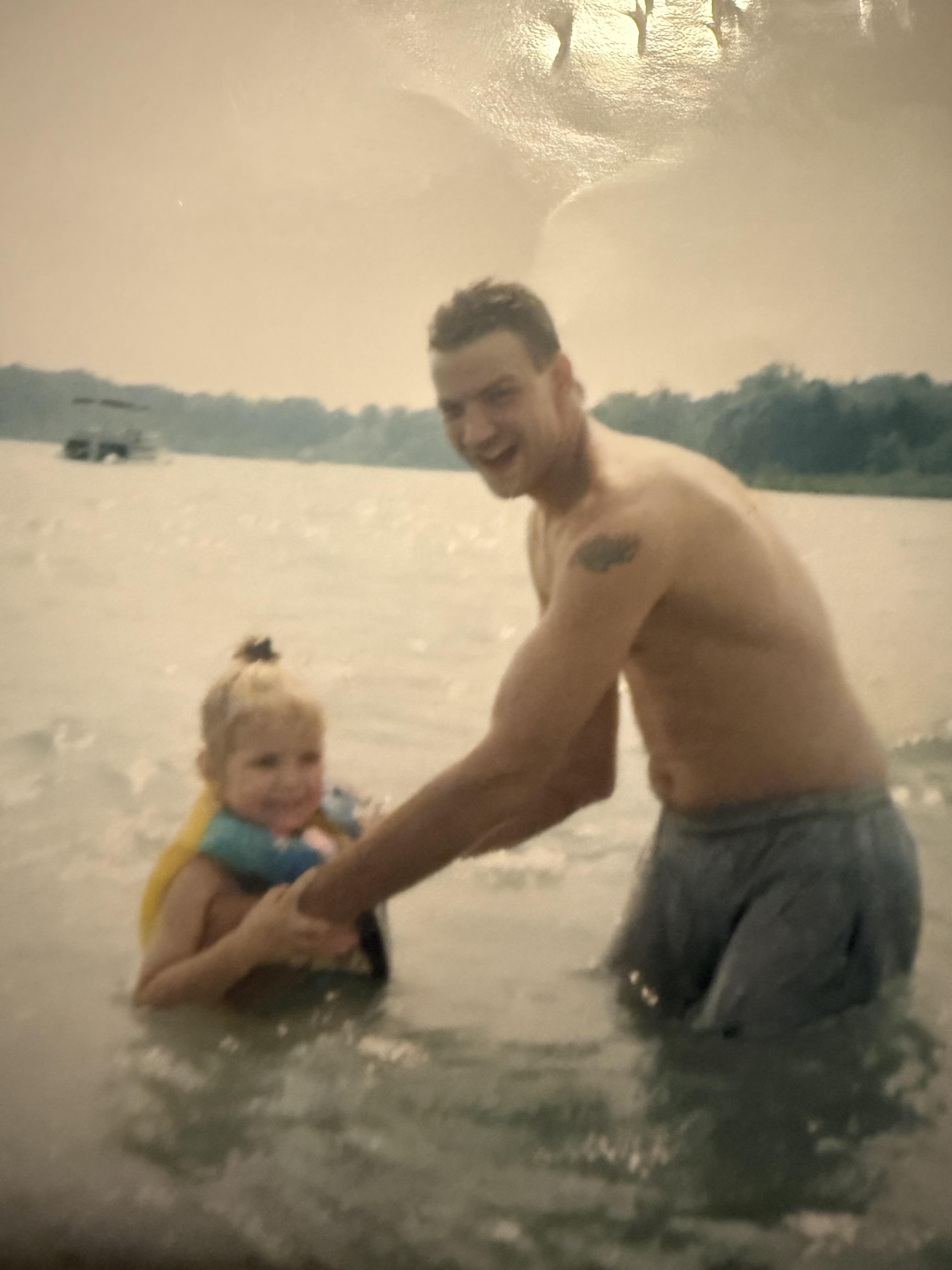 A man and a child in water