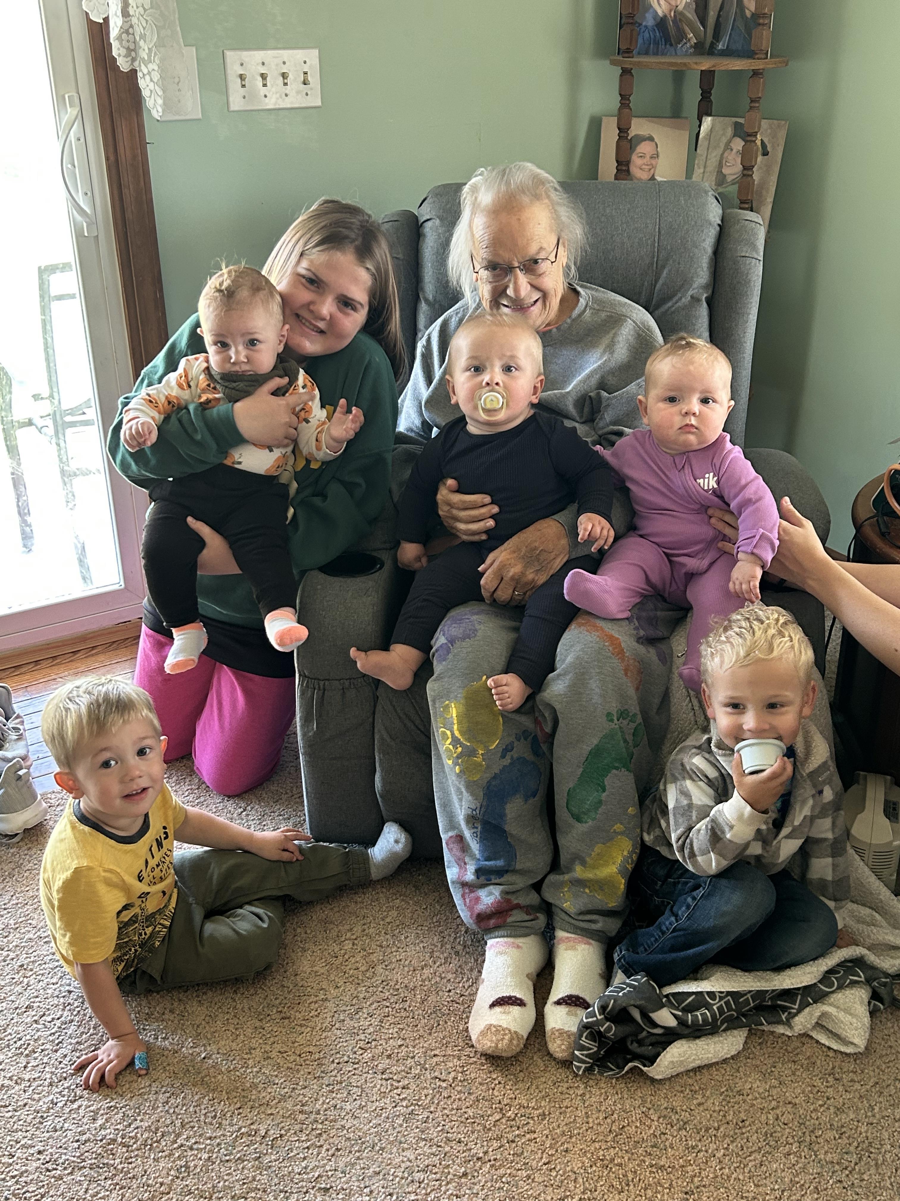 A group of people sitting on a chair