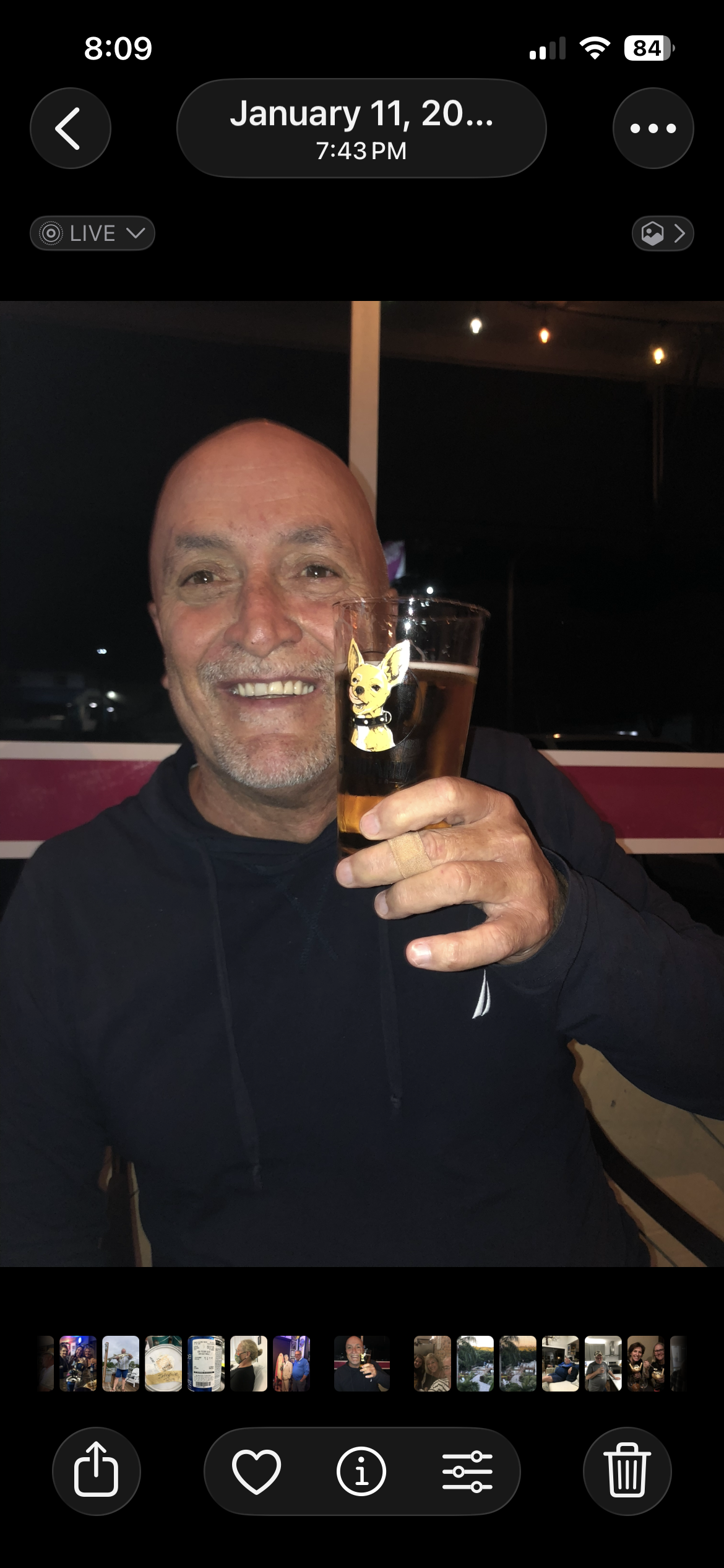 A man holding a glass of beer