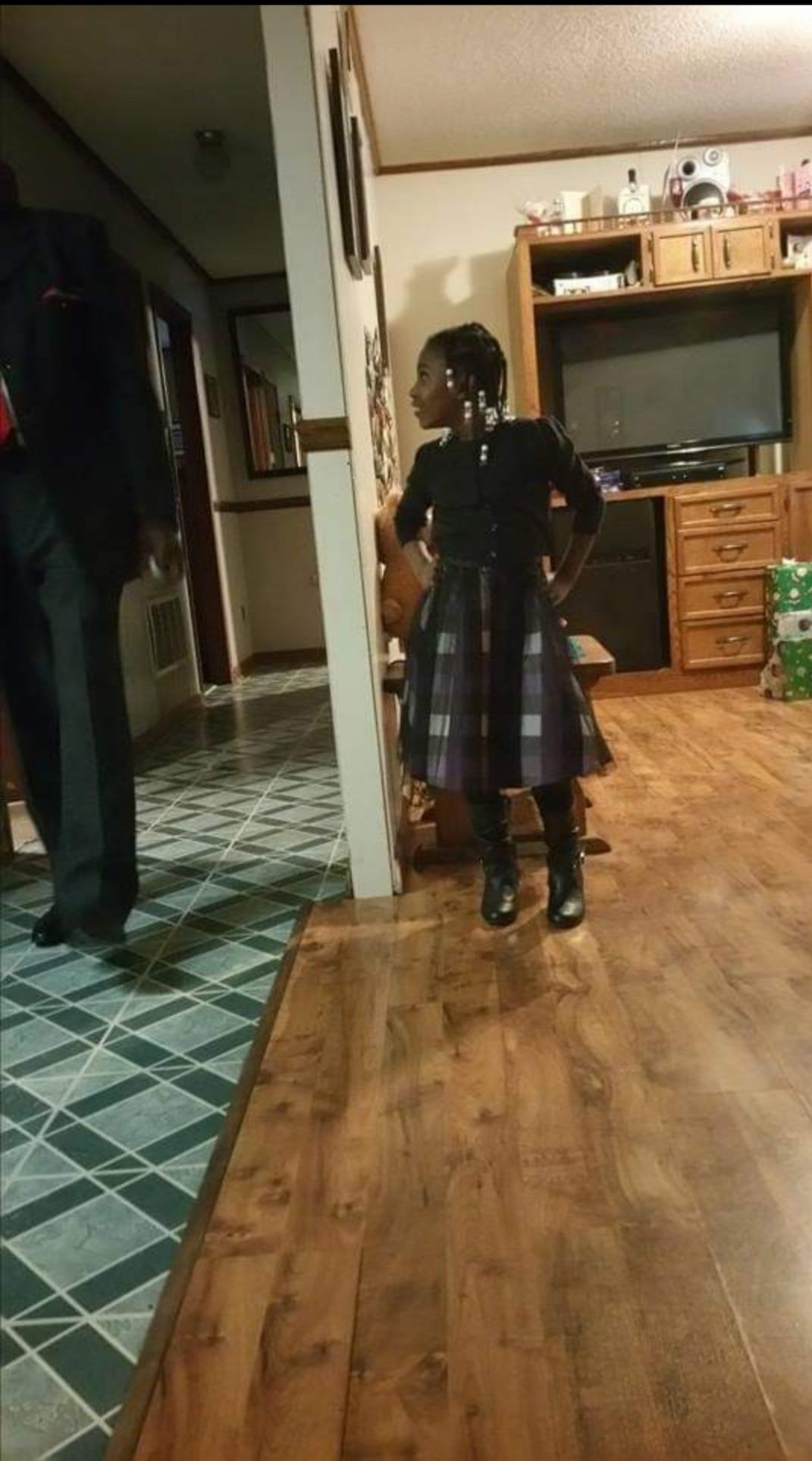 A girl standing in a room