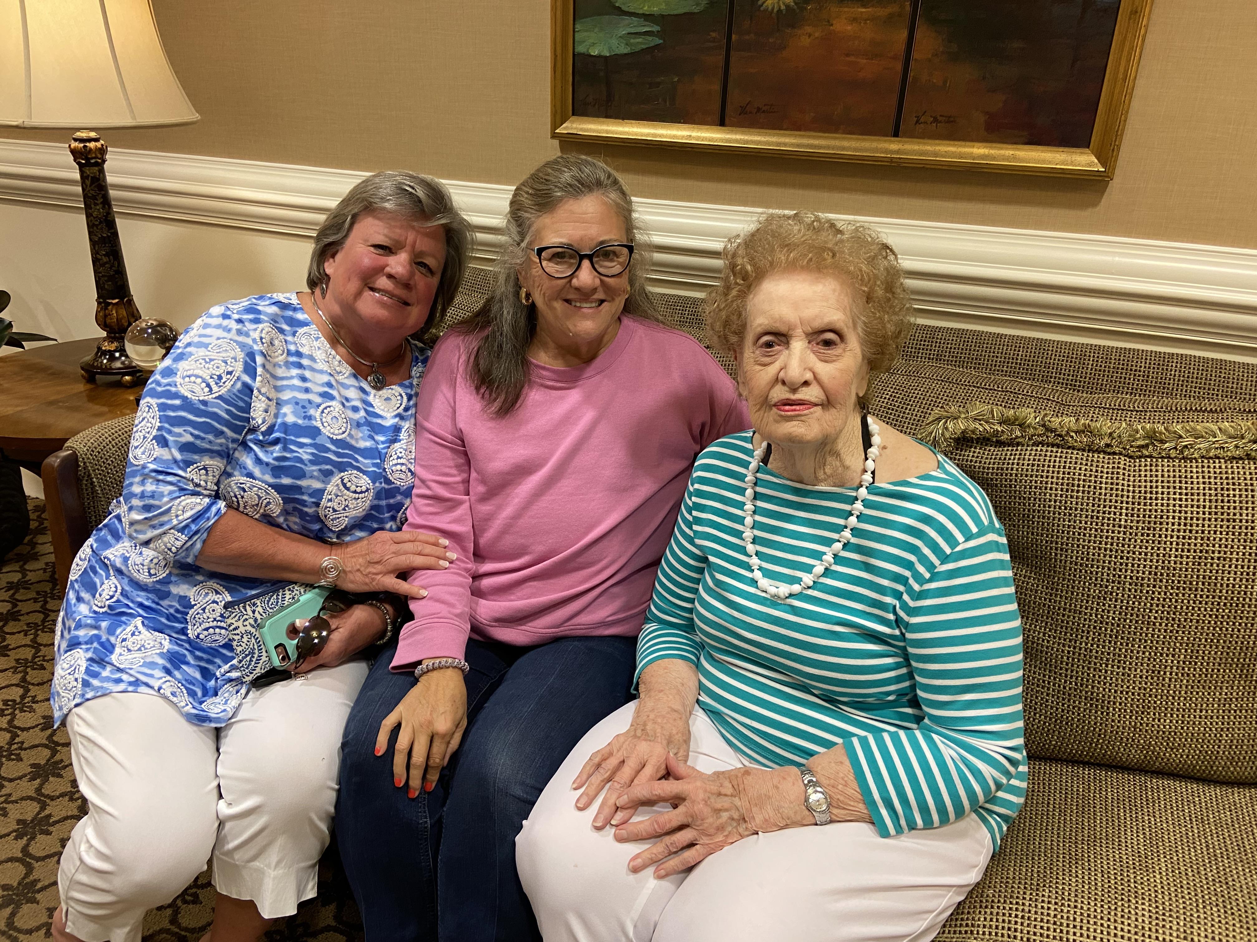 A group of women sitting on a couch