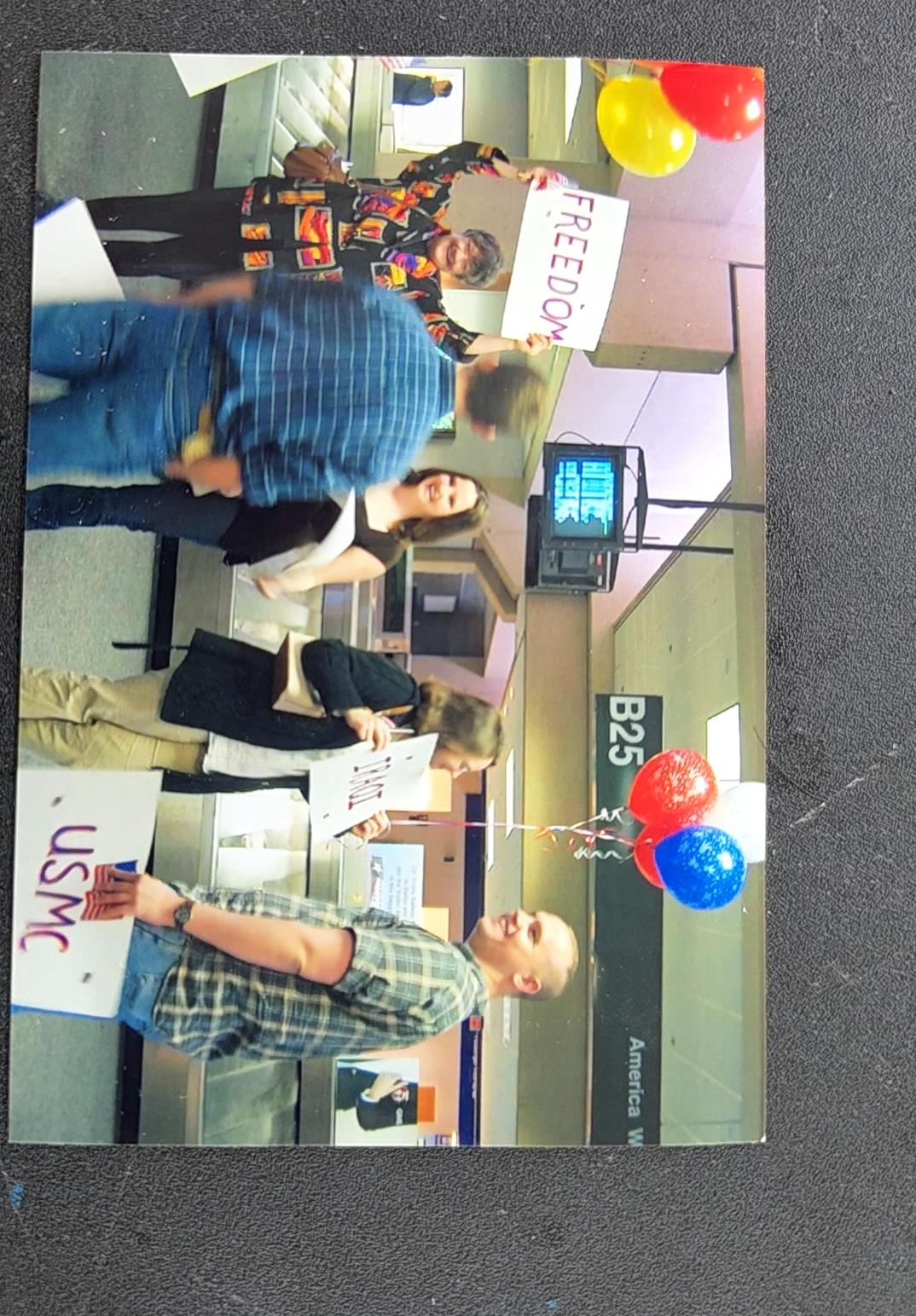 A group of people holding signs