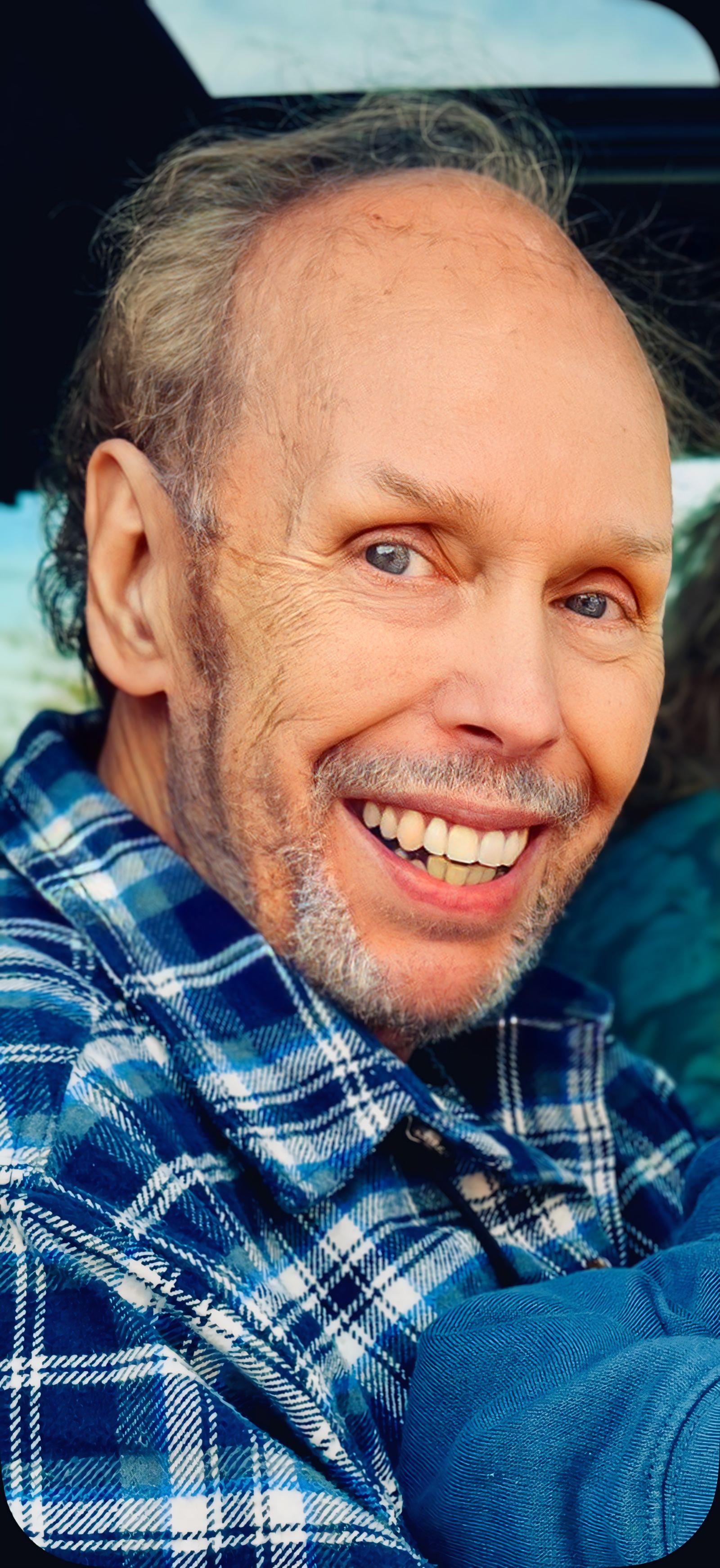 A man smiling at the camera
