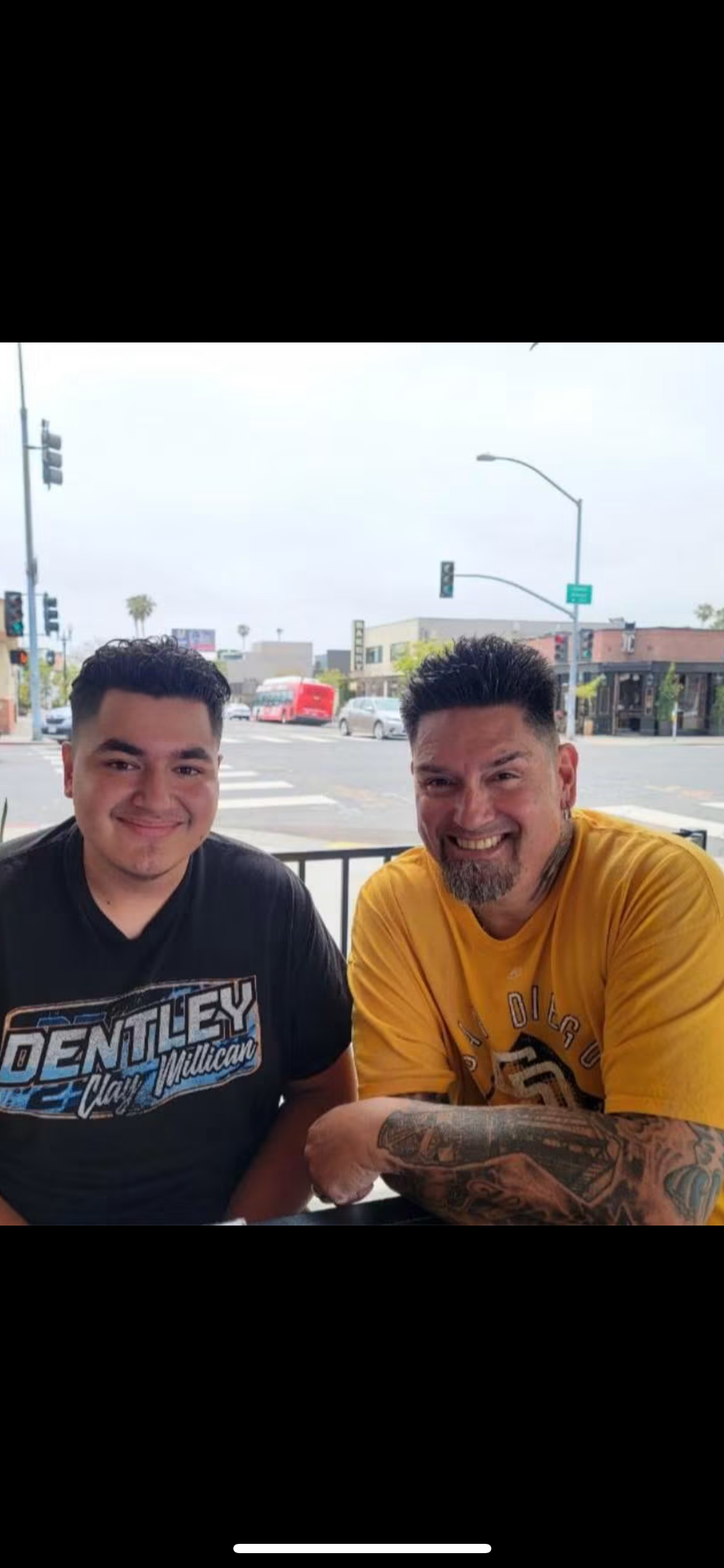 Two men sitting on a bench