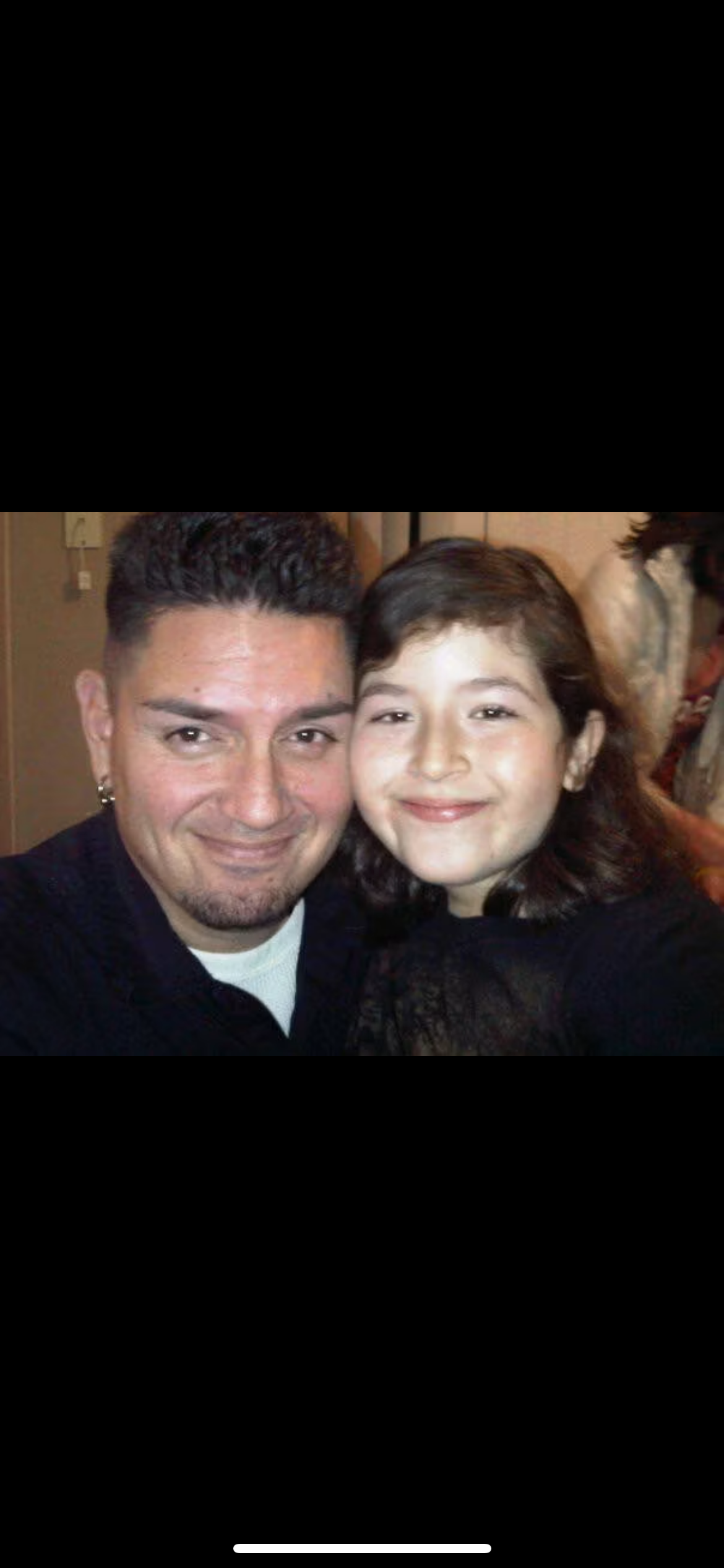 A man and a girl smiling
