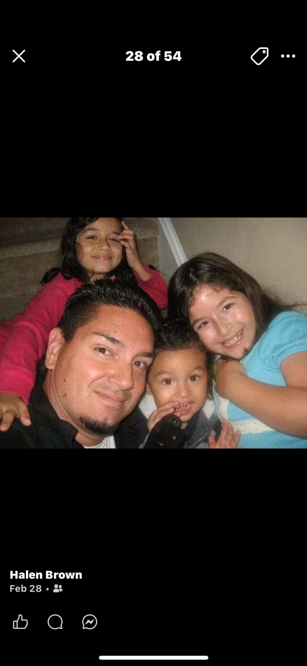 A man and children posing for a picture
