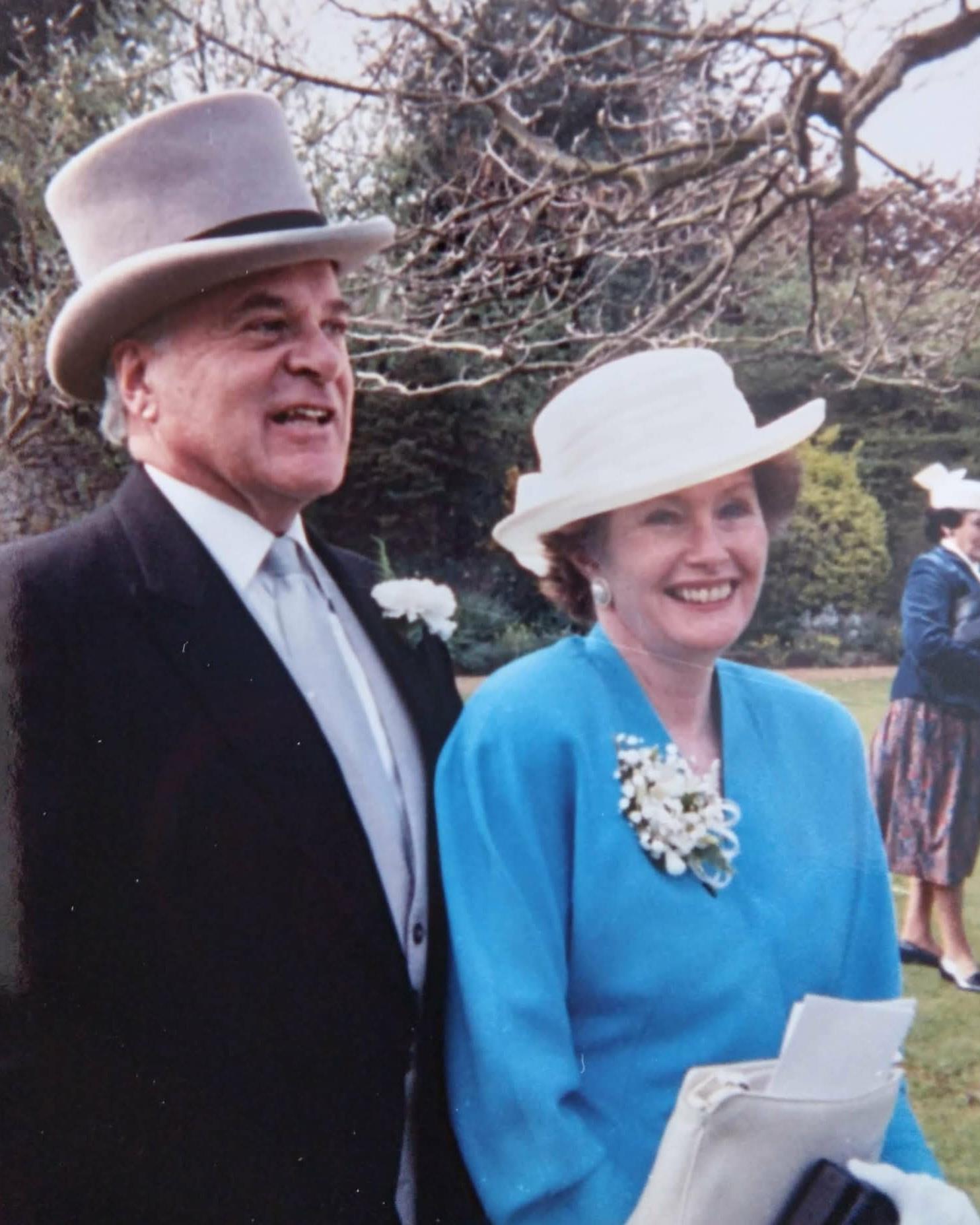 A man and woman wearing hats