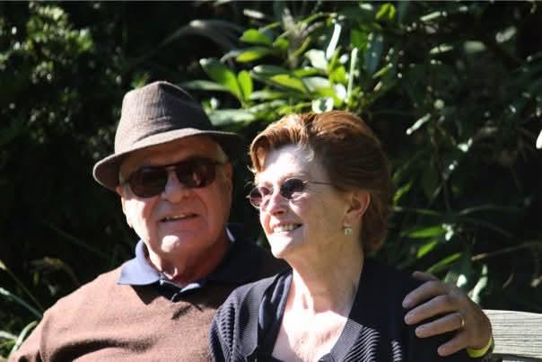 A man and woman smiling for the camera