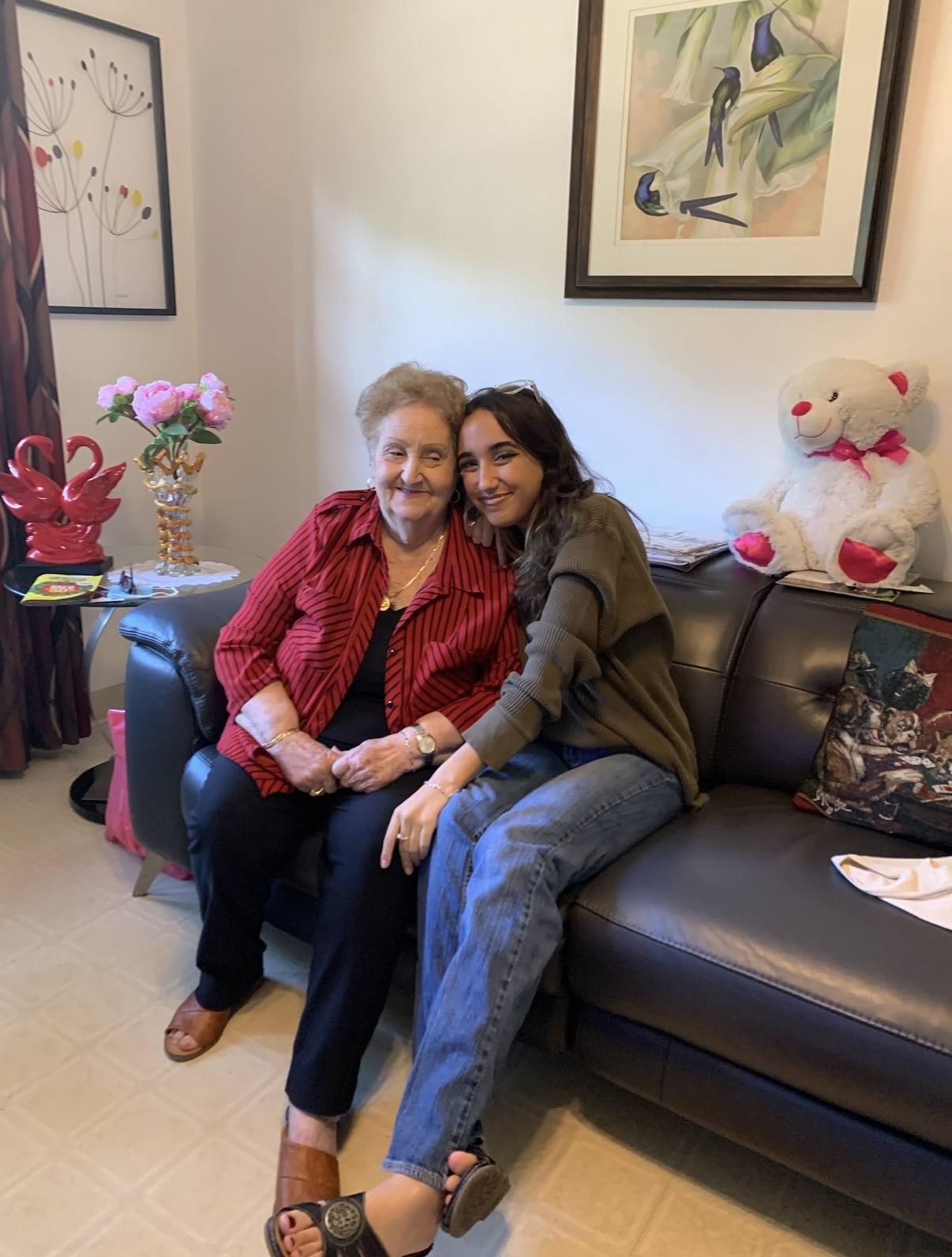 Two women sitting on a couch