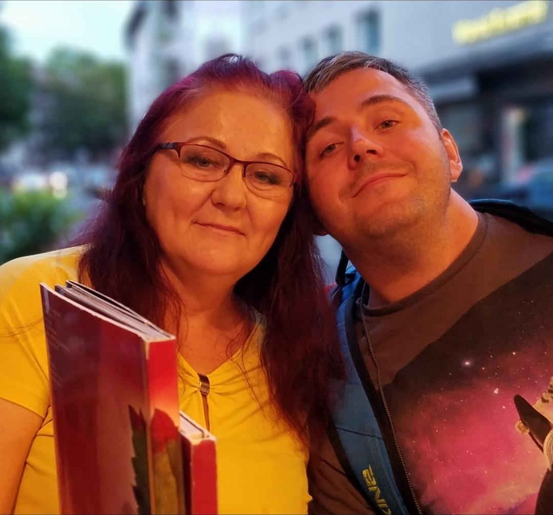 A man and woman posing for a picture