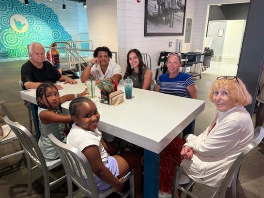 A group of people sitting at a table