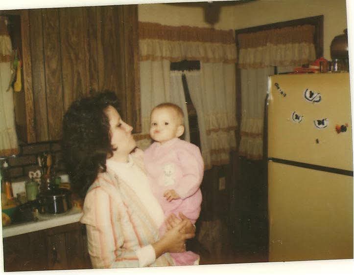 A woman holding a baby