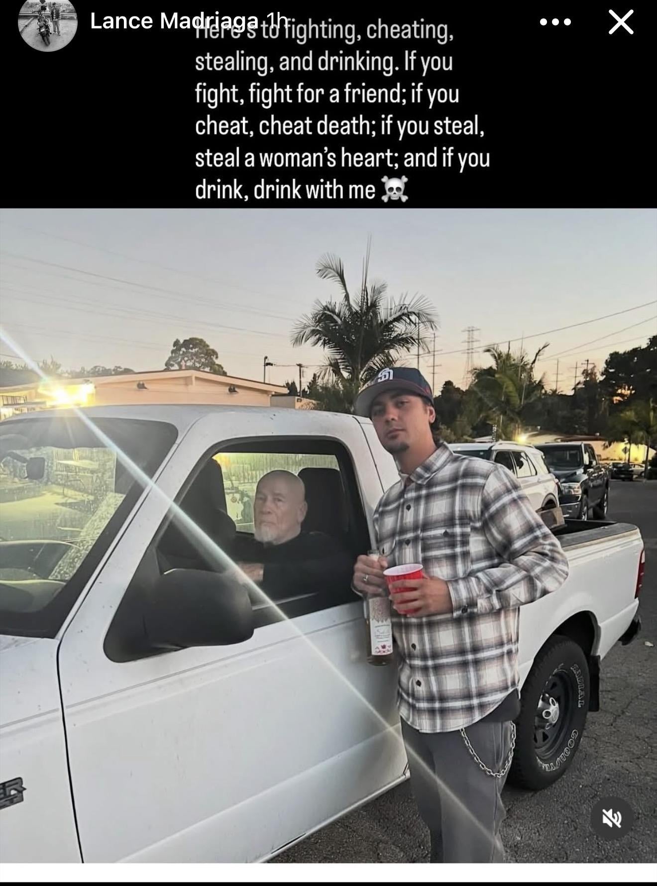 A man standing next to a truck