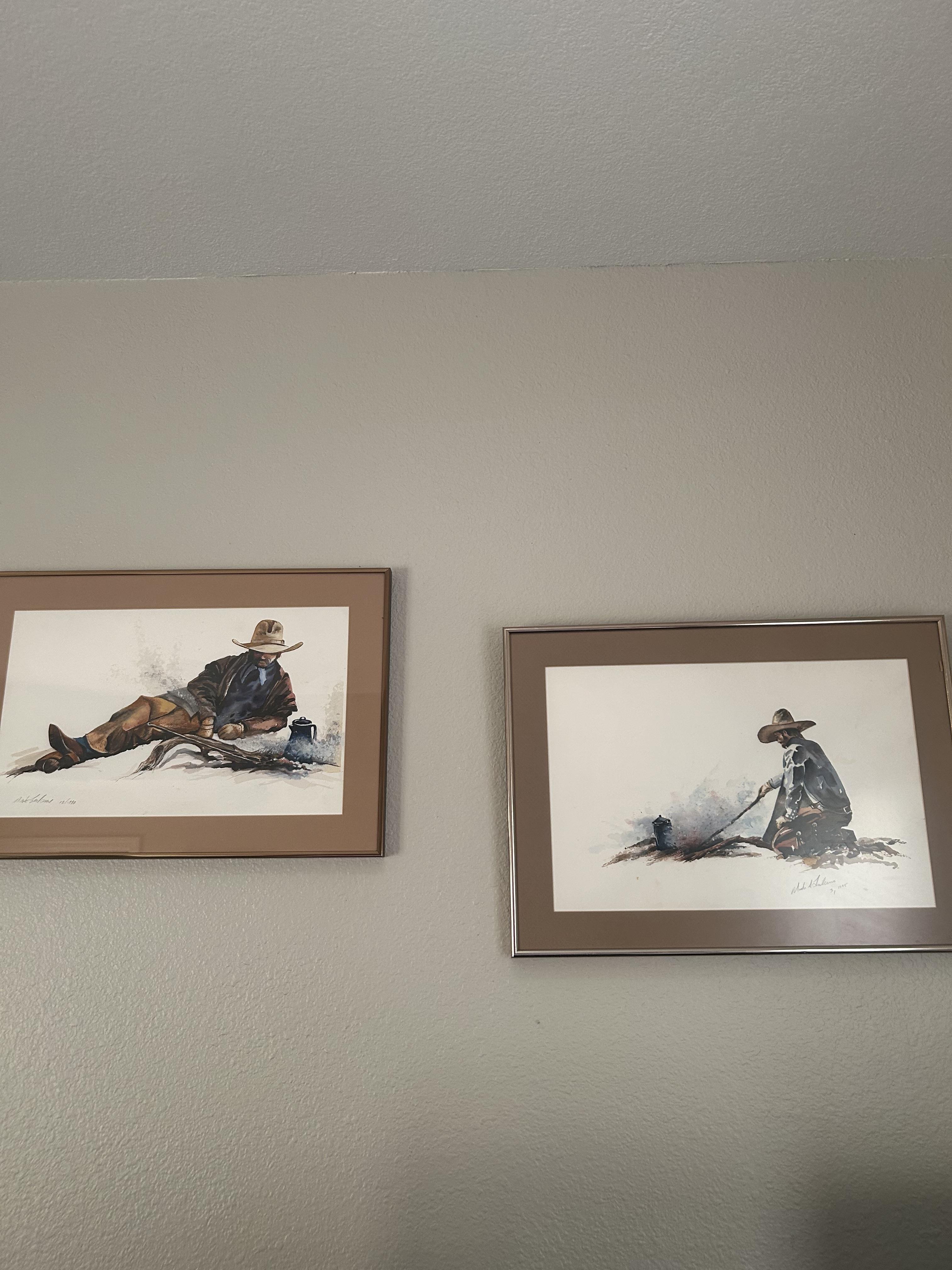 Two framed pictures on a wall