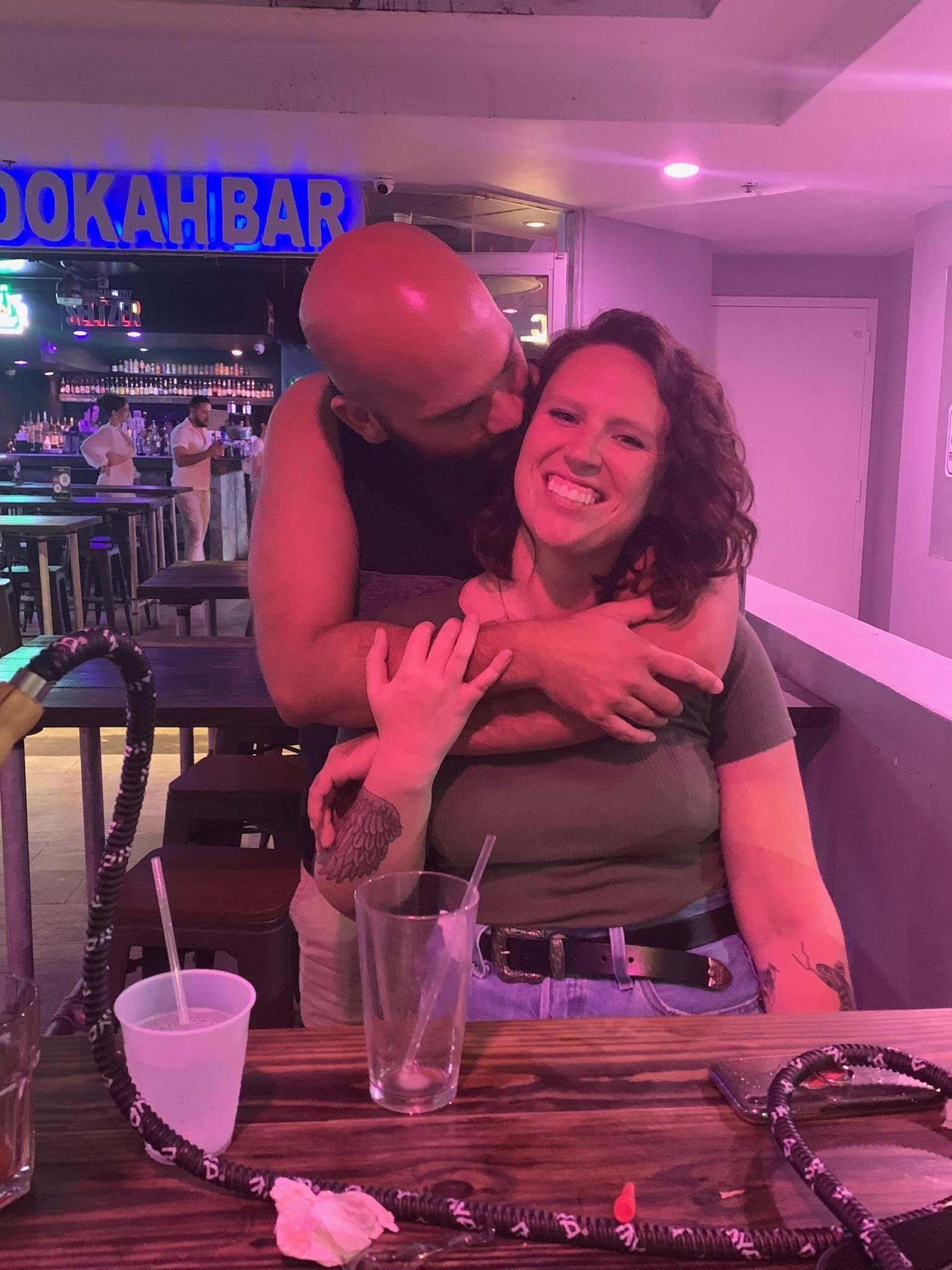 A man hugging a woman