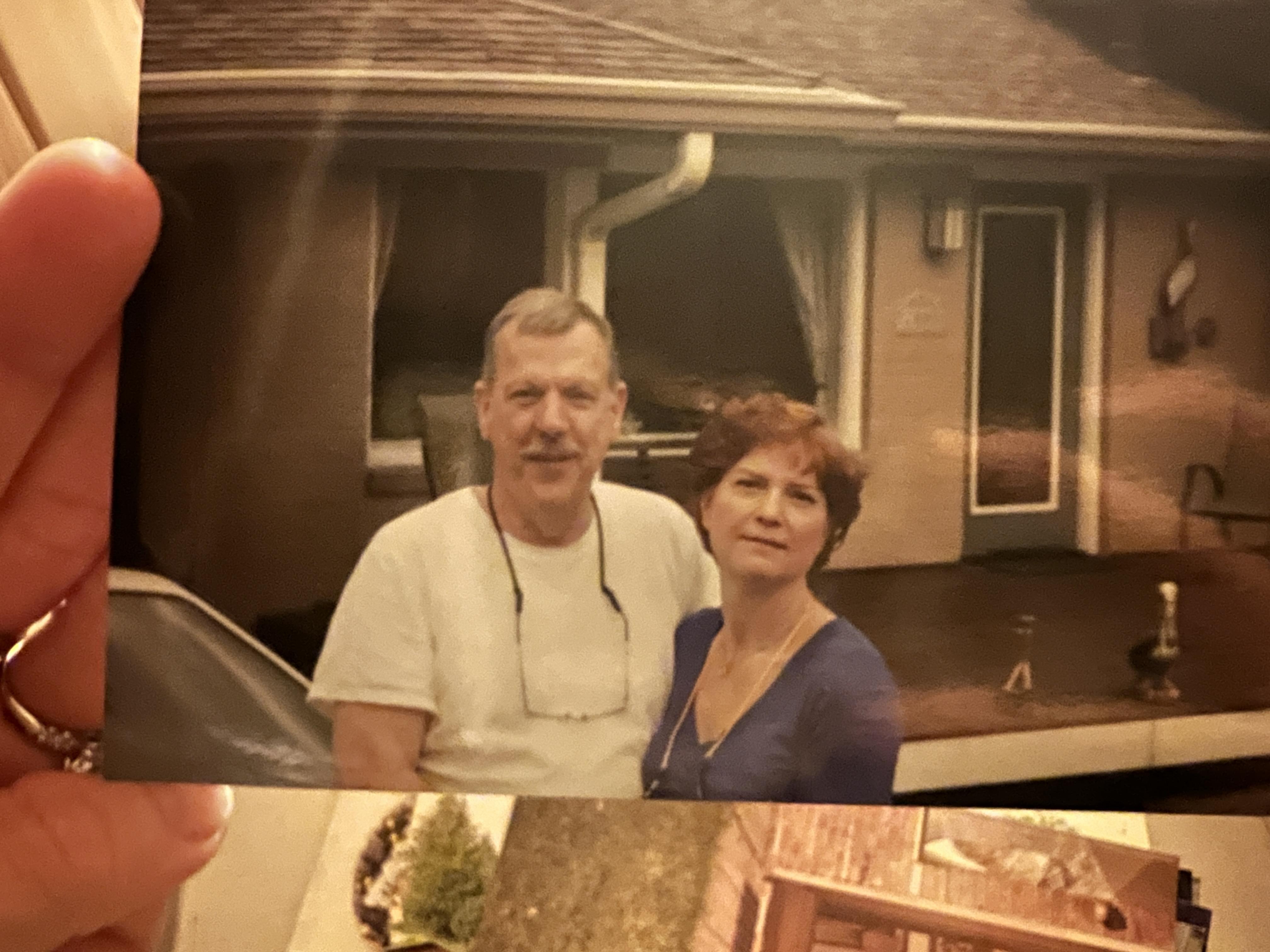 A man and woman posing for a picture
