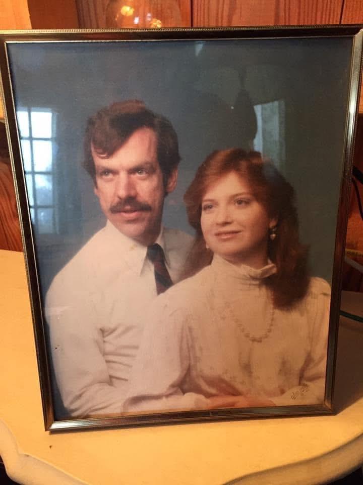 A man and woman in a framed picture